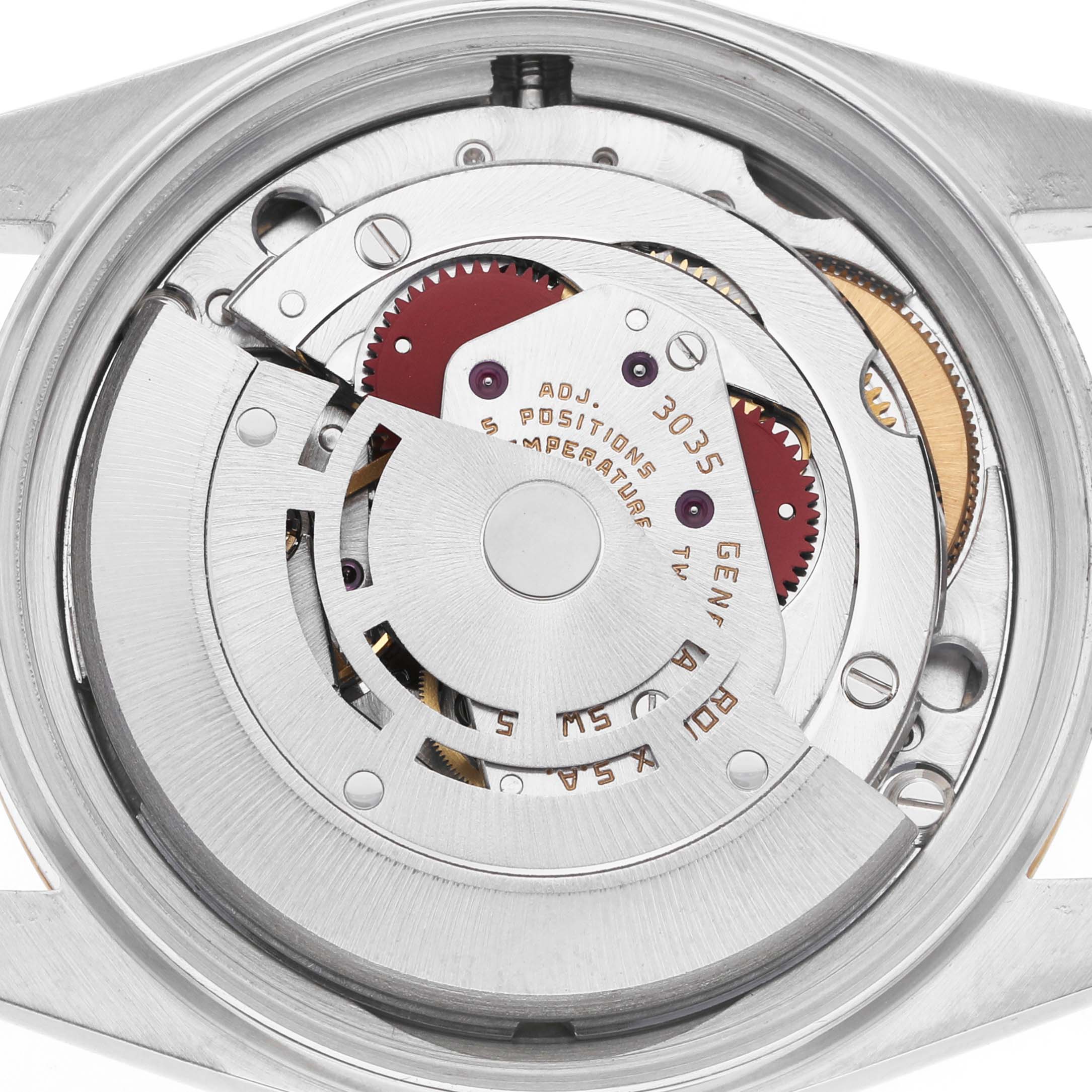 The image shows the movement of the Rolex Vintage Collection 16013 Men's Stainless Steel Silver Dial watch from the back, highlighting the gears and rotor.