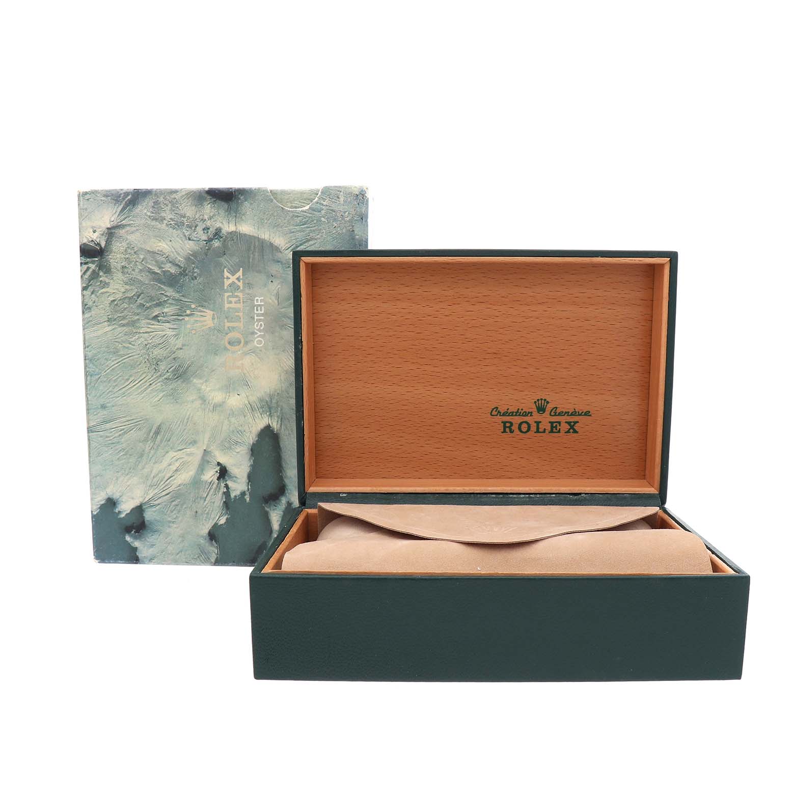 The image shows an open case of the Vintage Collection model by Rolex, with a cushion inside and an outer box behind.