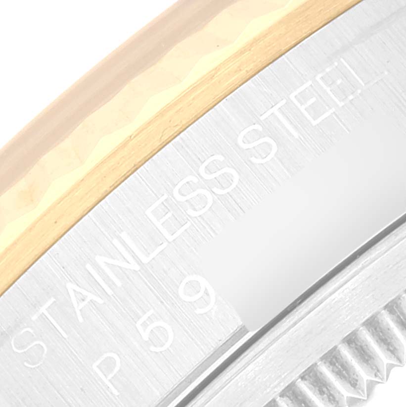 This close-up image shows the stainless steel and gold bezel of a Rolex Datejust 16233 Men's Steel and Gold (two tone) Mother of Pearl Dial 16233 Men's Steel and Gold (two tone) Mother of Pearl Dial watch.