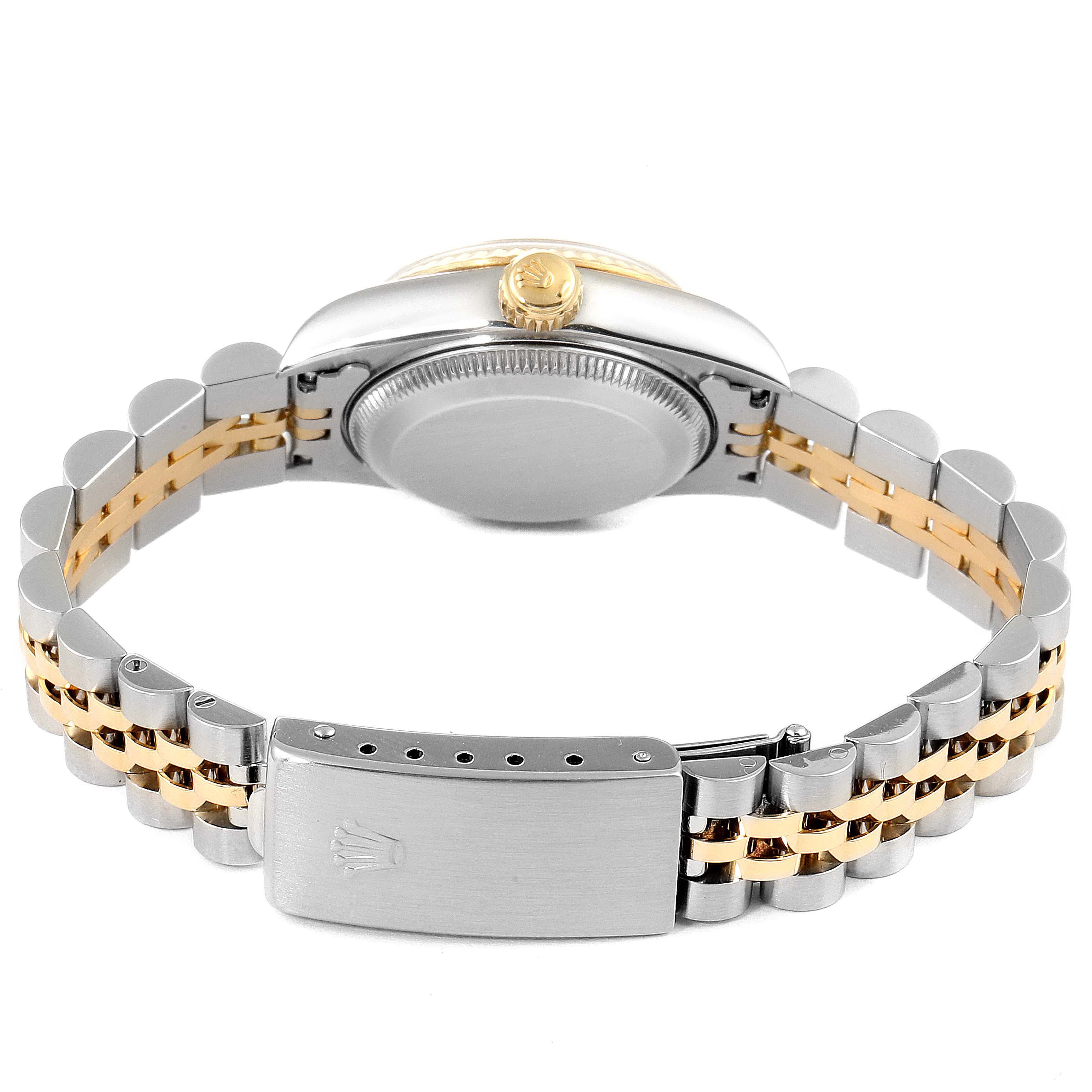 This image shows the back case and two-tone bracelet of a Rolex Datejust 69173 Women's Steel and Gold (two tone) Silver Dial 69173 Women's Steel and Gold (two tone) Silver Dial watch in a horizontal angle.