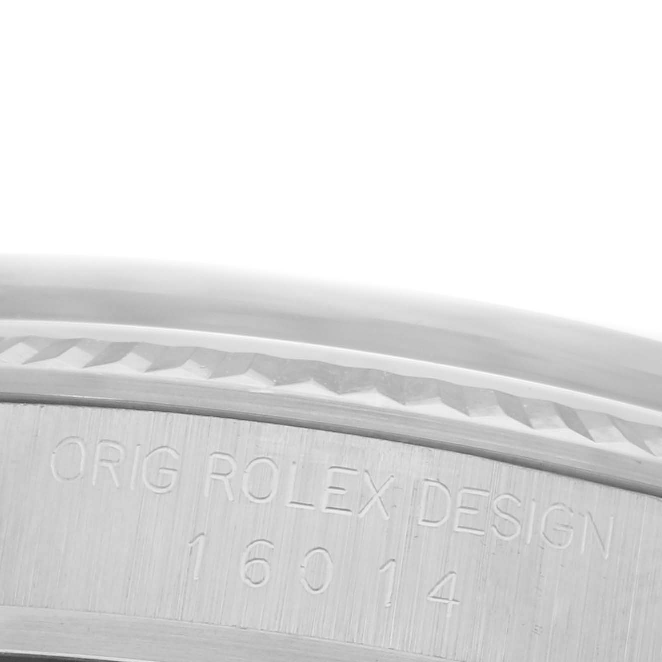 The image shows a close-up of the case side of a Rolex Datejust 16014 Men's Stainless Steel Blue Dial 16014 Men's Stainless Steel Blue Dial, focusing on the engraved serial text.