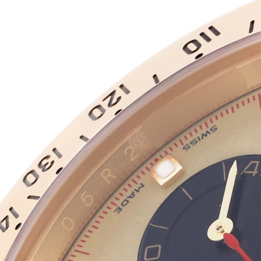 The image shows a close-up of the bezel and partial dial of a Rolex Daytona 116528 Men's Yellow Gold Champagne Dial 116528 Men's Yellow Gold Champagne Dial, displaying numerals and markers.