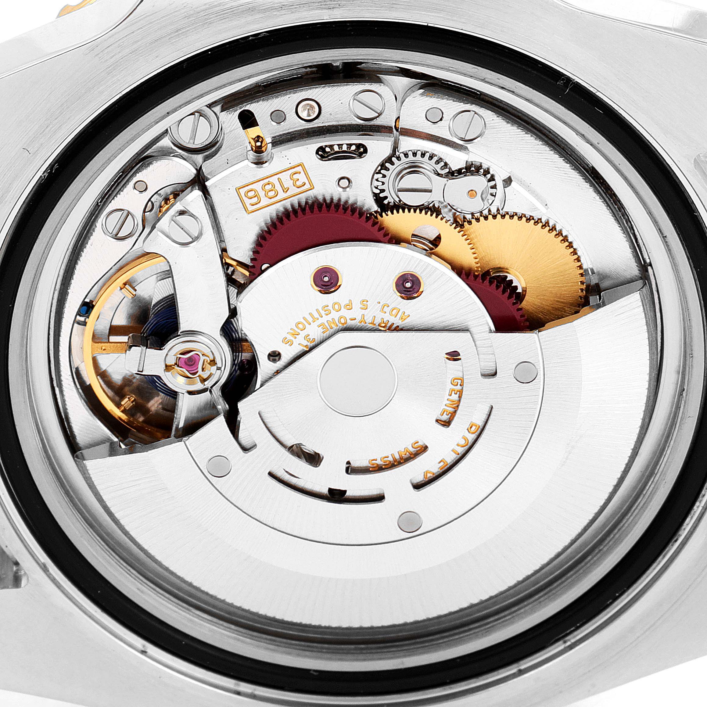 This image shows the movement and inner mechanics of the Rolex GMT-Master 116713 Men's Steel and Gold (two tone) Black Dial 116713 Men's Steel and Gold (two tone) Black Dial watch from a top-down perspective.