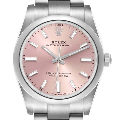 The image shows a front view of a Rolex Oyster Perpetual watch, highlighting its pink dial and stainless steel bracelet.