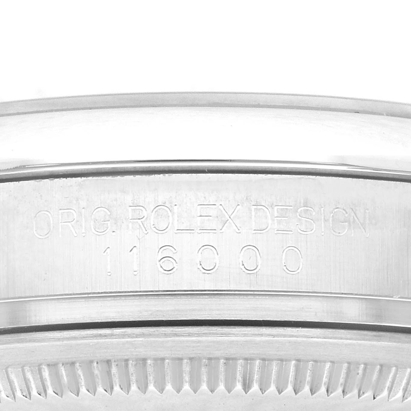 This image shows a close-up view of the engraved side profile of a Rolex Oyster Perpetual 116000 Men
s Stainless Steel Blue Dial 116000 Men
s Stainless Steel Blue Dial model watch, specifically model 116000.