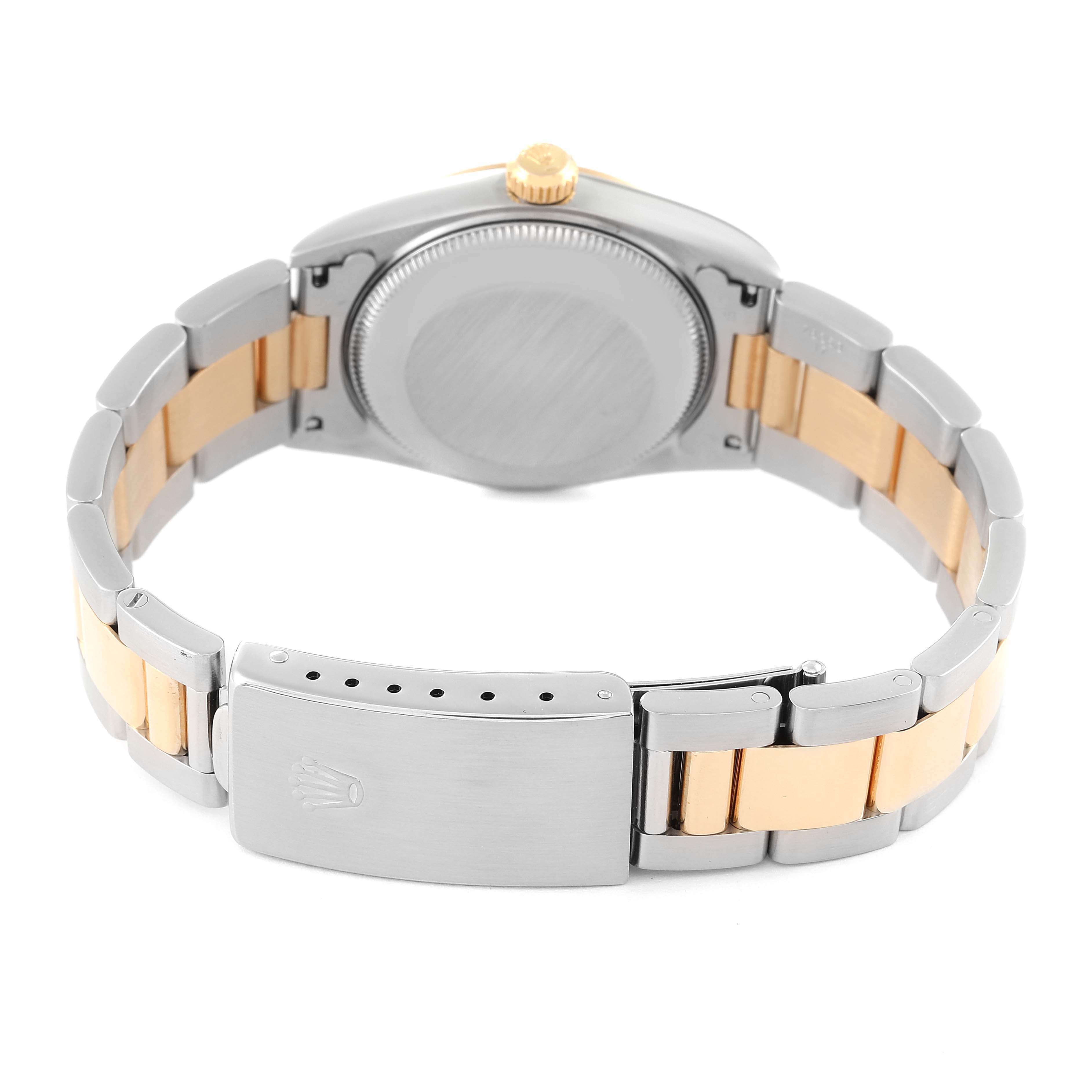 The image shows the backside and clasp of a Mid-Size Rolex watch, highlighting its two-tone bracelet and closed case back.