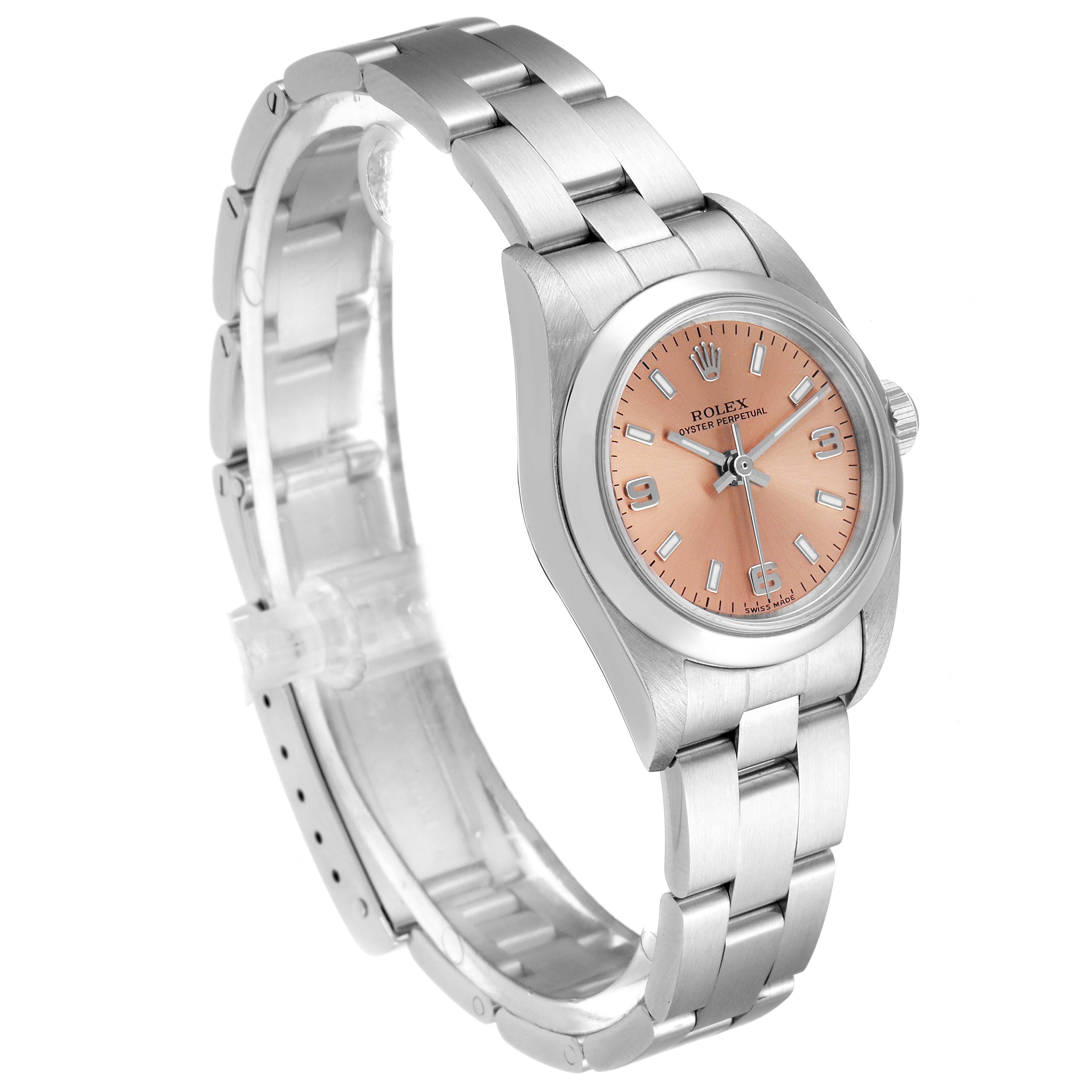 The Rolex Oyster Perpetual 76080 Women's Stainless Steel Pink Dial 76080 Women's Stainless Steel Pink Dial watch is shown at a slight angle, highlighting its strap, case, and salmon pink dial.