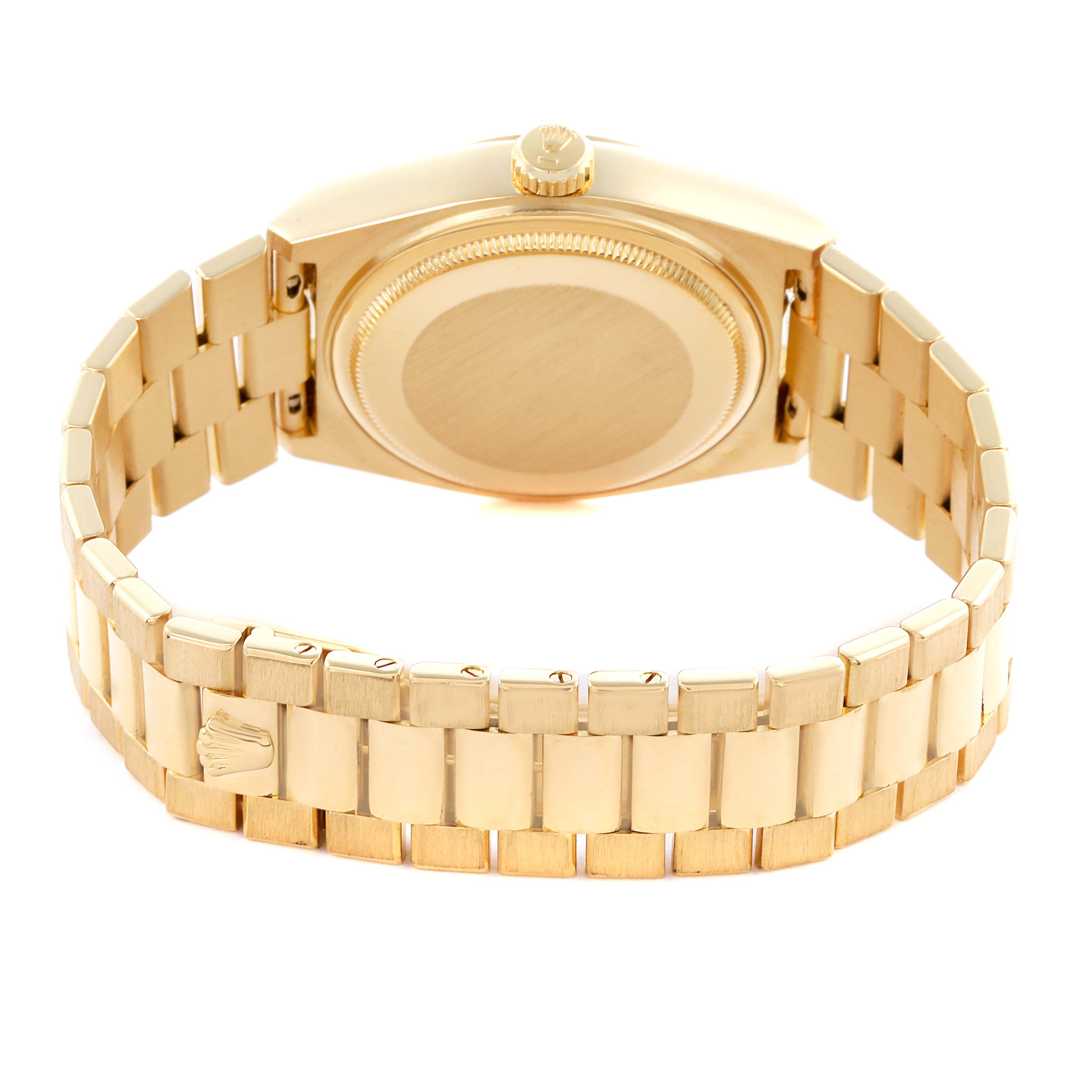 The image shows the Rolex Oysterquartz 19018 Men's Yellow Gold Champagne Dial 19018 Men's Yellow Gold Champagne Dial watch from a rear angle, highlighting its gold case back and bracelet.