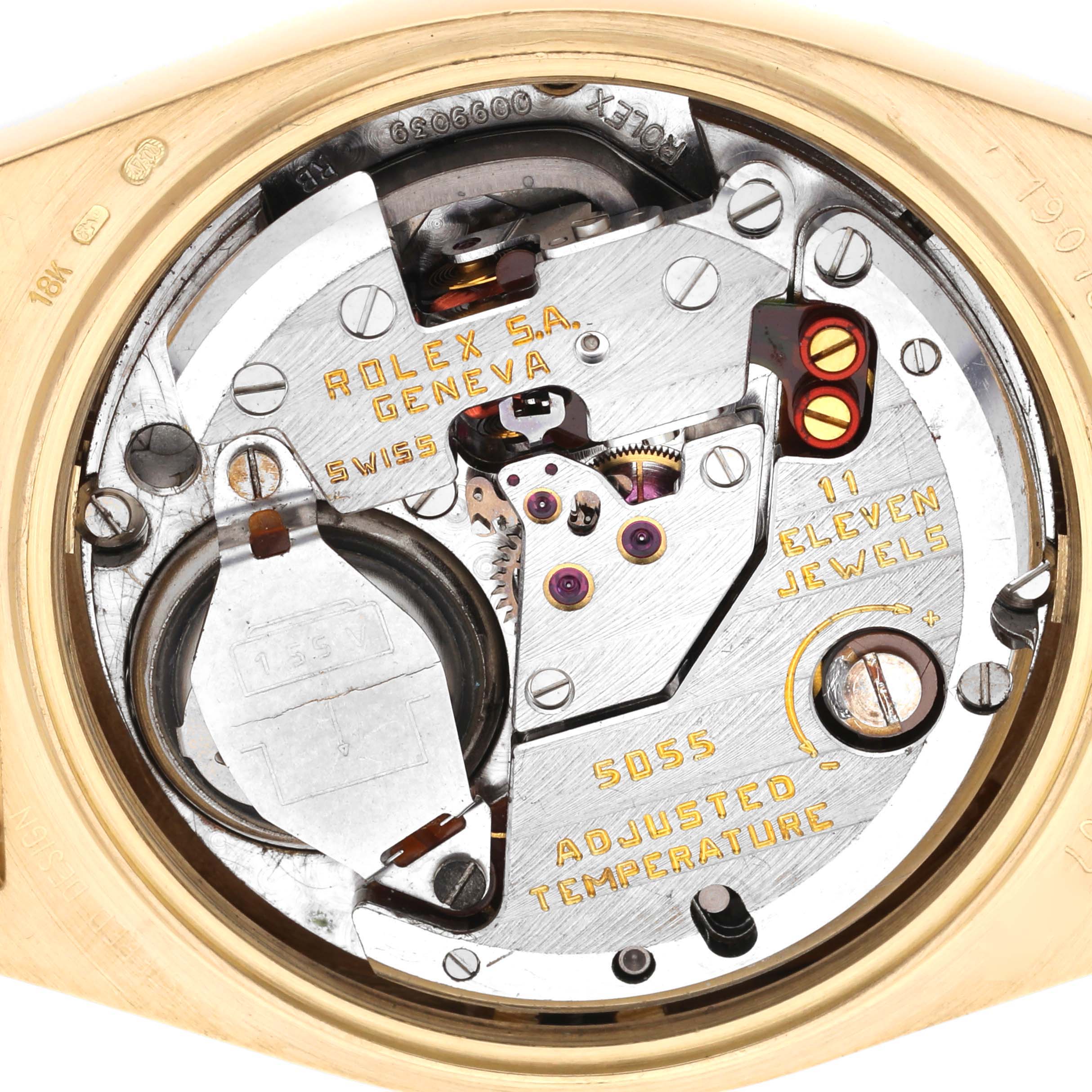 The image shows the movement of a Rolex Oysterquartz 19018 Men's Yellow Gold Champagne Dial 19018 Men's Yellow Gold Champagne Dial watch from the back, highlighting gears, jewels, and engravings.