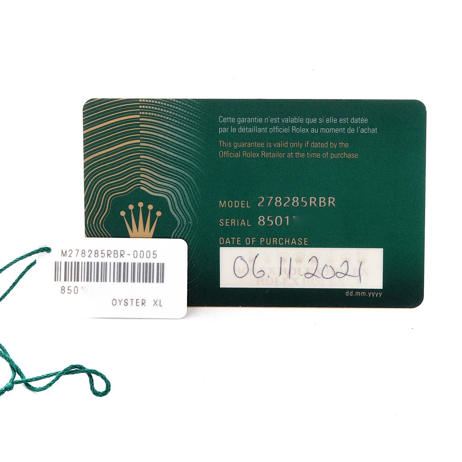 The image shows a Rolex guarantee card and tag for the Mid-Size model 278285RBR, with purchase date and serial number.