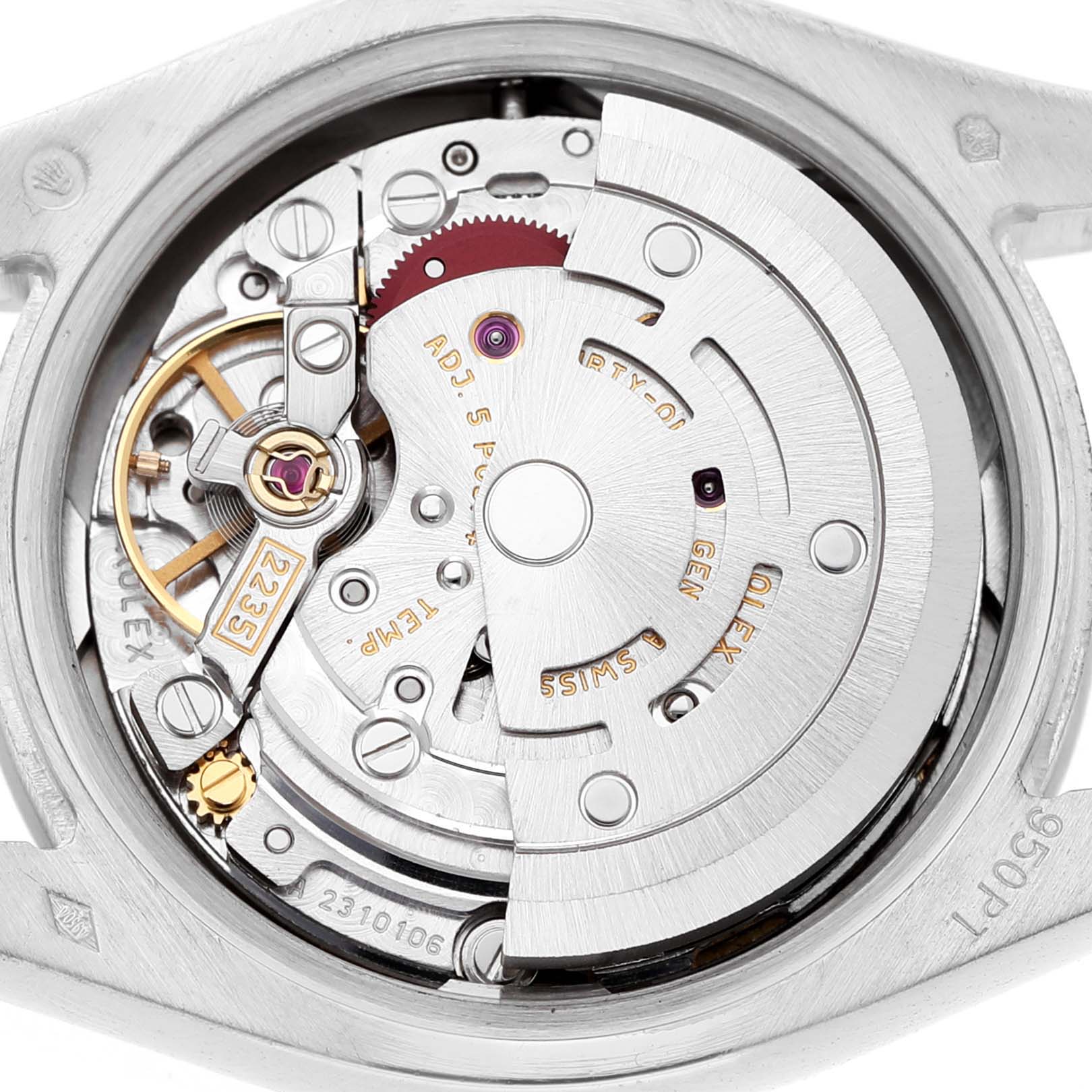 The image shows the movement of a Rolex President 179166 Women's Platinum Blue Dial watch from the back, highlighting gears and the rotor.