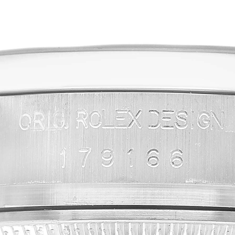 The image shows a close-up of the case side of a Rolex President 179166 Women's Platinum Blue Dial model, highlighting the "ORIG. ROLEX DESIGN" engraving and model number.
