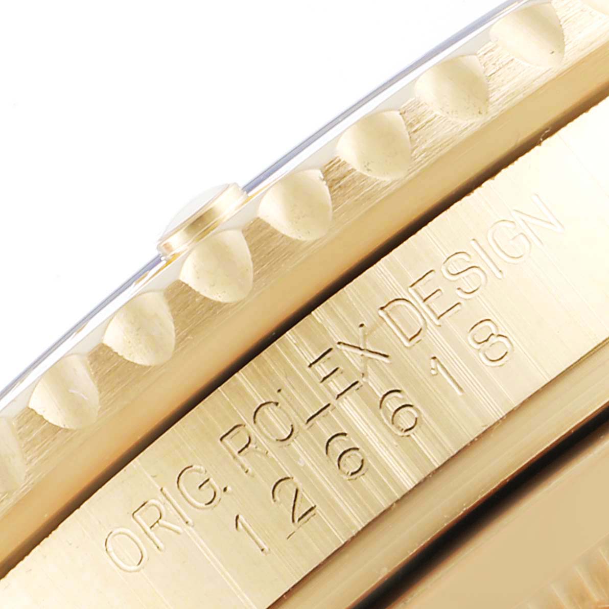 The image shows an angled close-up of the side of a Rolex Submariner 126618 Men's Yellow Gold Black Dial 126618 Men's Yellow Gold Black Dial watch, highlighting the engravings and bezel details.