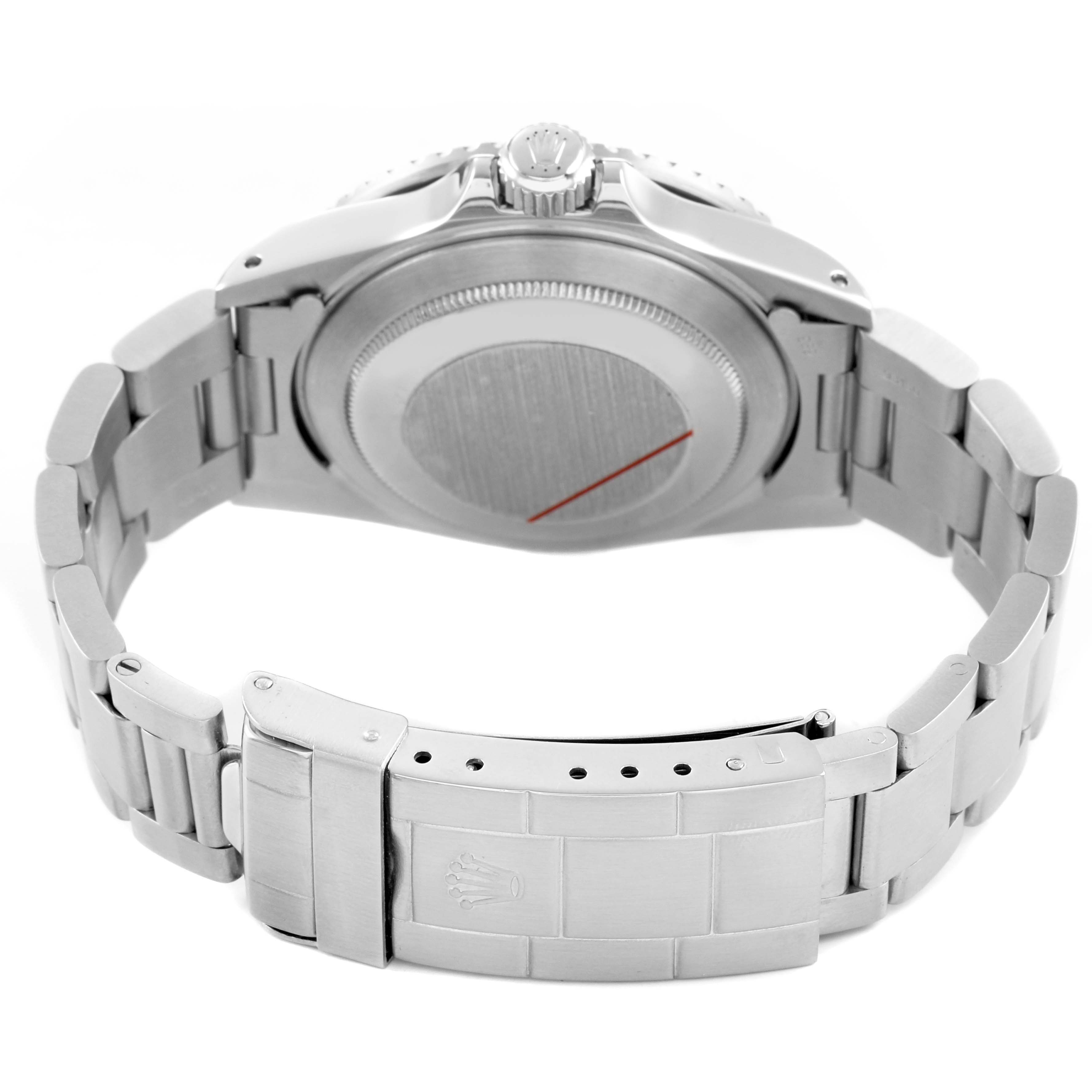 The Rolex Submariner 168000 Men's Stainless Steel Black Dial is shown from the back, displaying the case back, crown, and bracelet clasp.