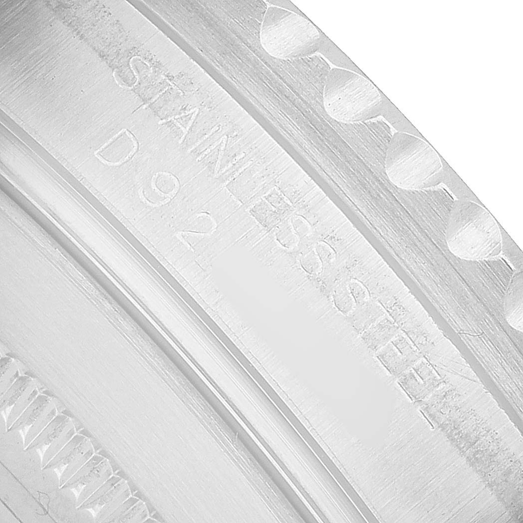 The image shows a close-up of the bezel and case edge of a Rolex Submariner 16610LV Men's Stainless Steel Black Dial, highlighting the engravings and stainless steel material.