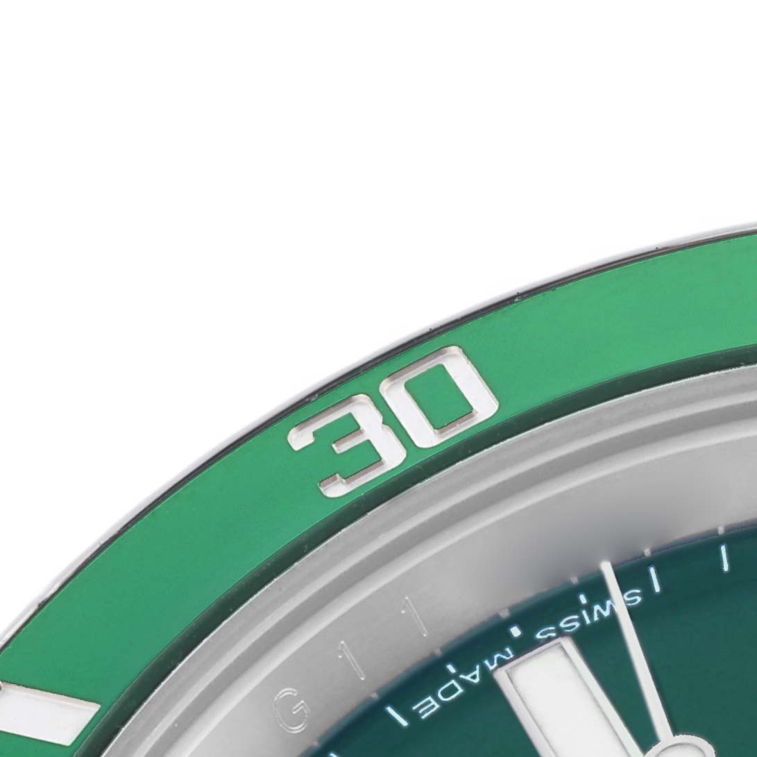 The image shows a close-up of the bezel and part of the dial with hands of a Rolex Submariner 116610LV Men's Stainless Steel Green Dial 116610LV Men's Stainless Steel Green Dial watch.