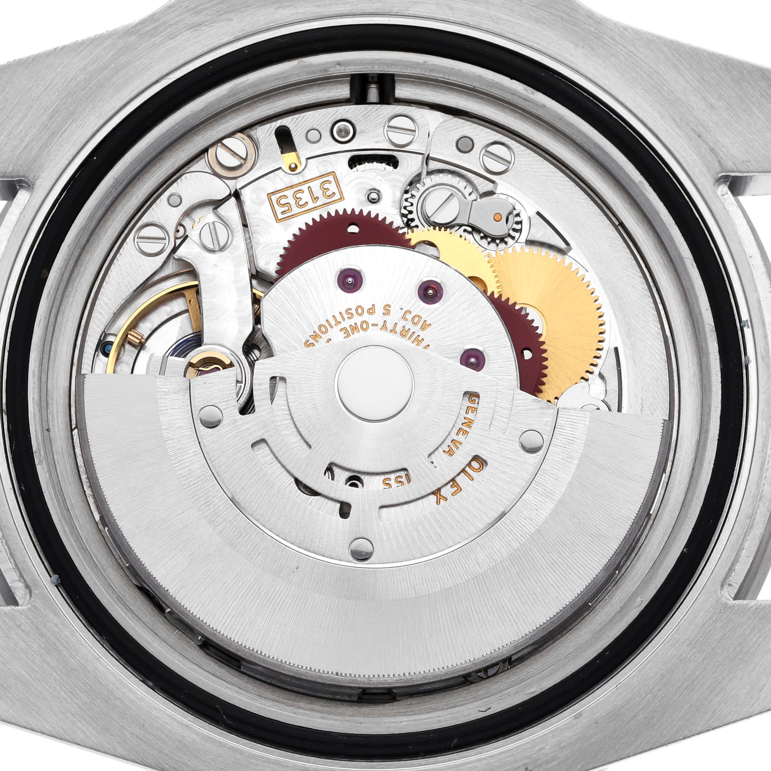 The image shows the movement of a Rolex Submariner 116610LV Men's Stainless Steel Green Dial 116610LV Men's Stainless Steel Green Dial, focusing on the detailed internal mechanisms and rotor.