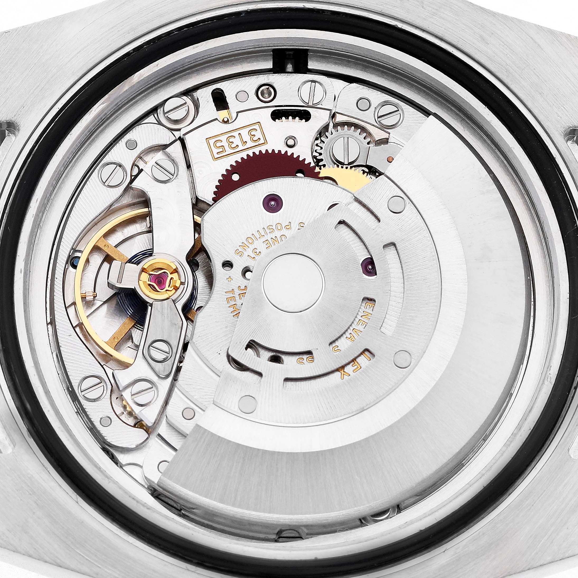 The image shows the internal mechanism of a Rolex Submariner 116613 Men's Steel and Gold (two tone) Blue Dial watch from a top-down angle.