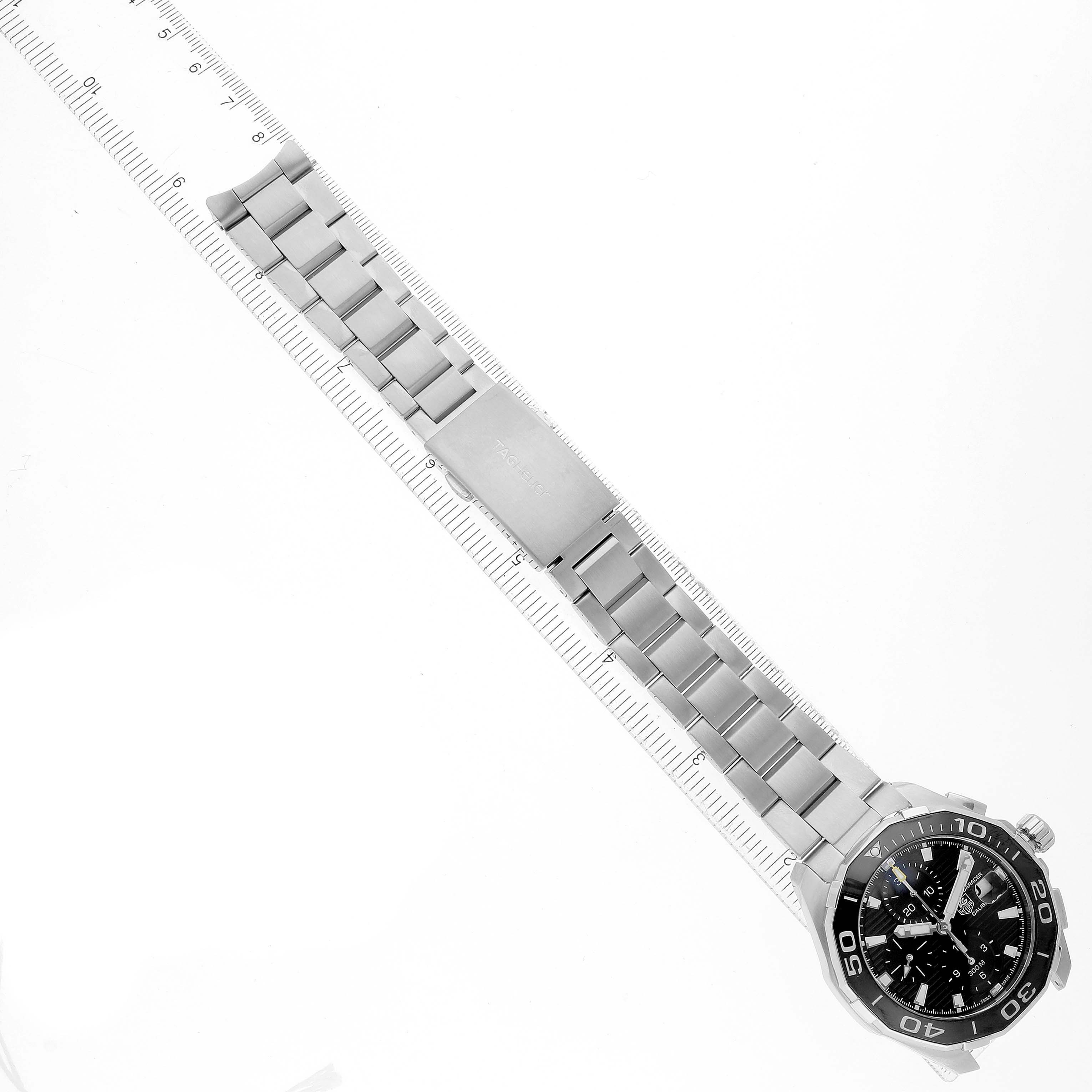 The image shows a Tag Heuer Aquaracer CAY211A.BA0927 Men's Stainless Steel Black Dial watch flat, displaying its face, bezel, and metal bracelet fully extended.