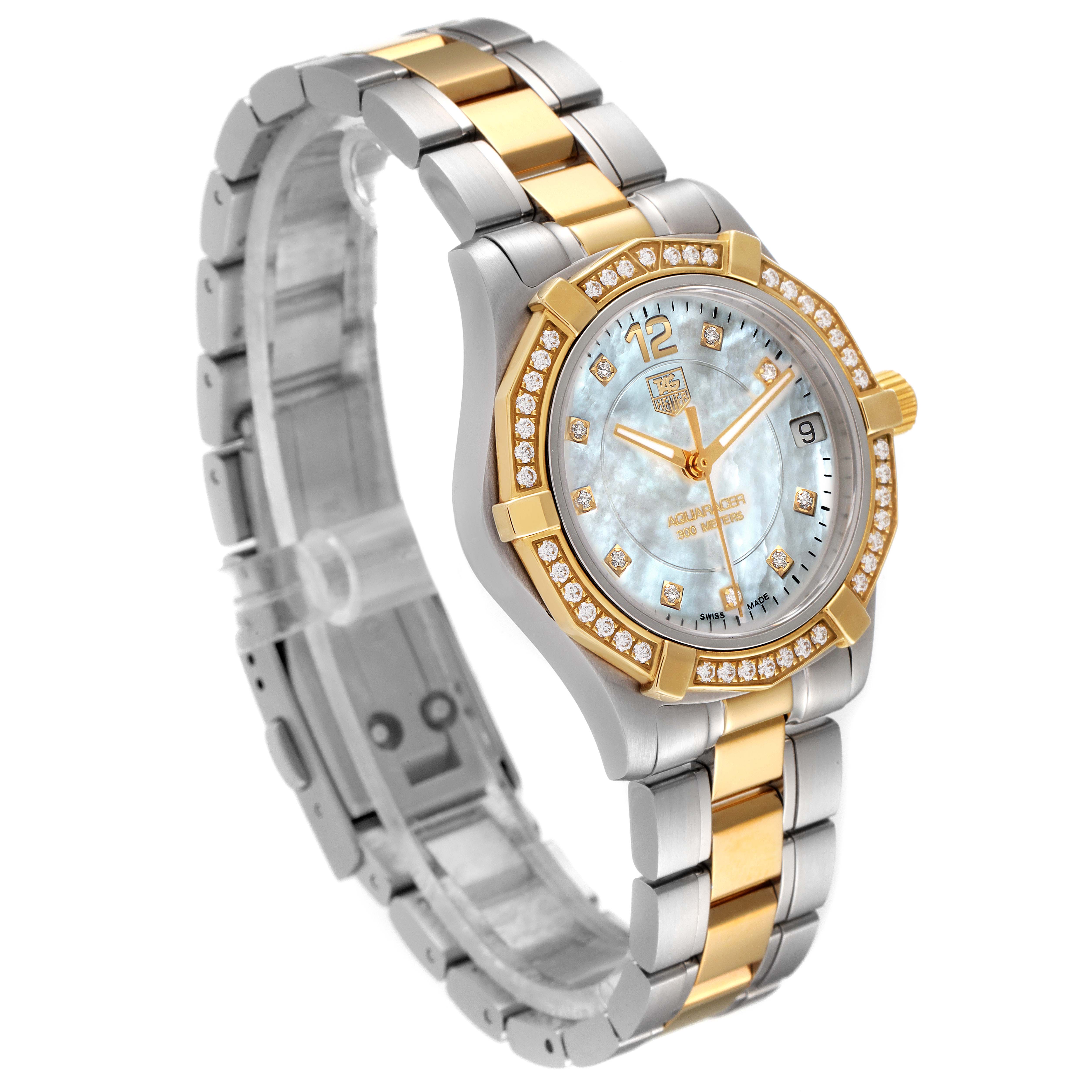 The Tag Heuer Aquaracer WAF1450.BB0820 Women
s Steel and Gold (two tone) Mother of Pearl Dial WAF1450.BB0820 Women
s Steel and Gold (two tone) Mother of Pearl Dial watch is shown from a three-quarter front angle, highlighting its bezel, face, and metal bracelet.