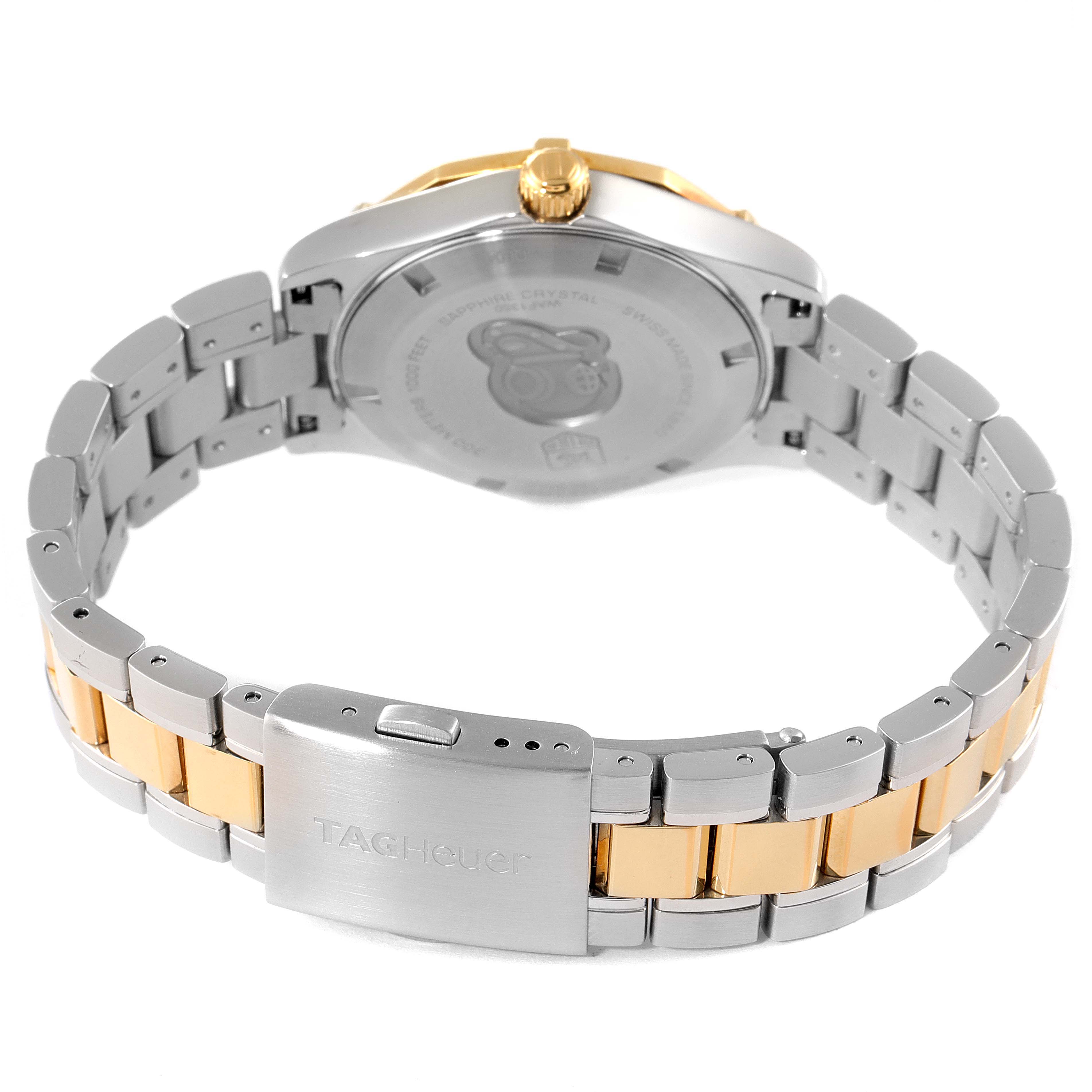 The image shows the back case and clasp of the Tag Heuer Aquaracer WAF1450.BB0820 Women
s Steel and Gold (two tone) Mother of Pearl Dial WAF1450.BB0820 Women
s Steel and Gold (two tone) Mother of Pearl Dial watch, displaying its two-tone metal bracelet.