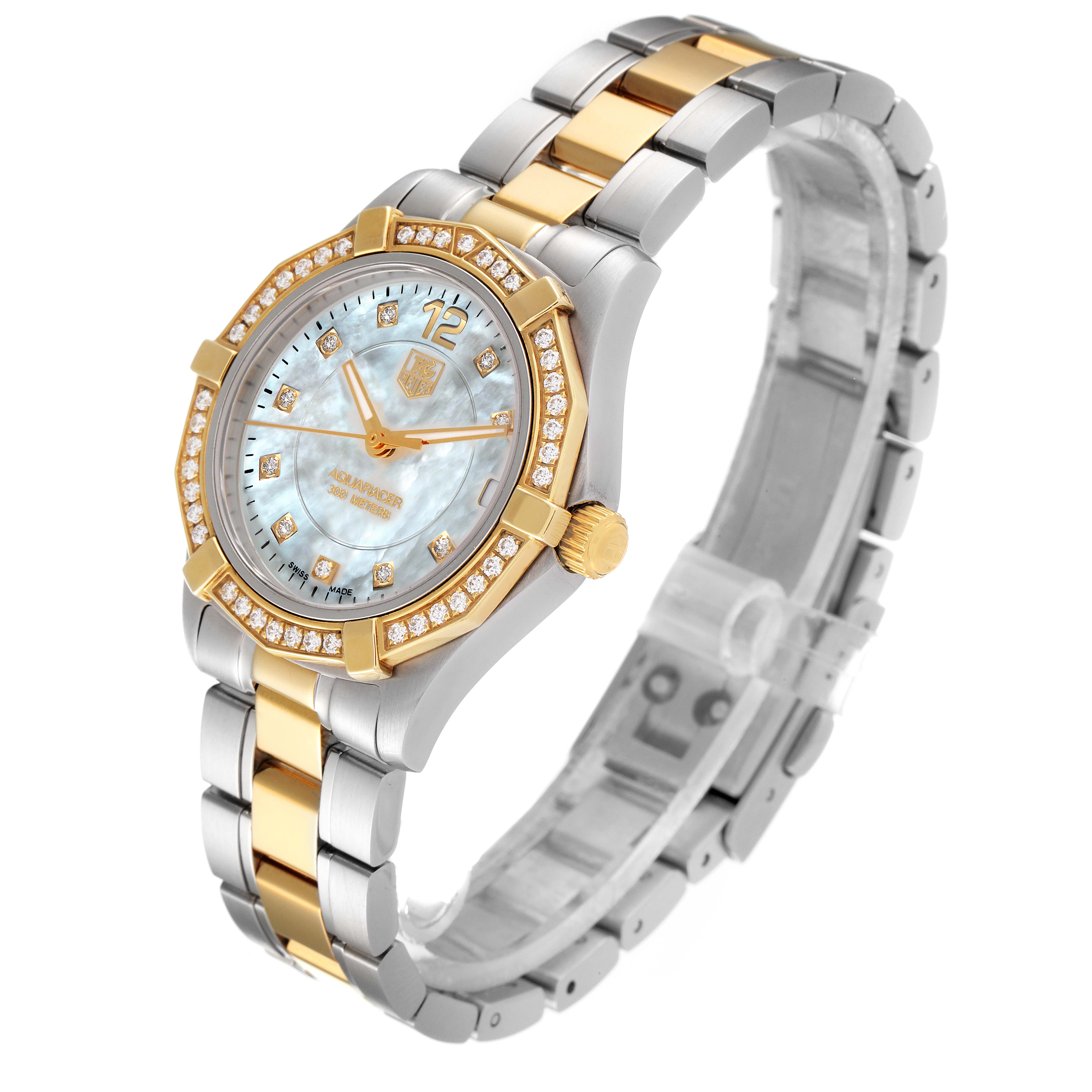 The Tag Heuer Aquaracer WAF1450.BB0820 Women
s Steel and Gold (two tone) Mother of Pearl Dial WAF1450.BB0820 Women
s Steel and Gold (two tone) Mother of Pearl Dial watch is shown at a three-quarter angle, displaying the face, bezel, and bracelet.