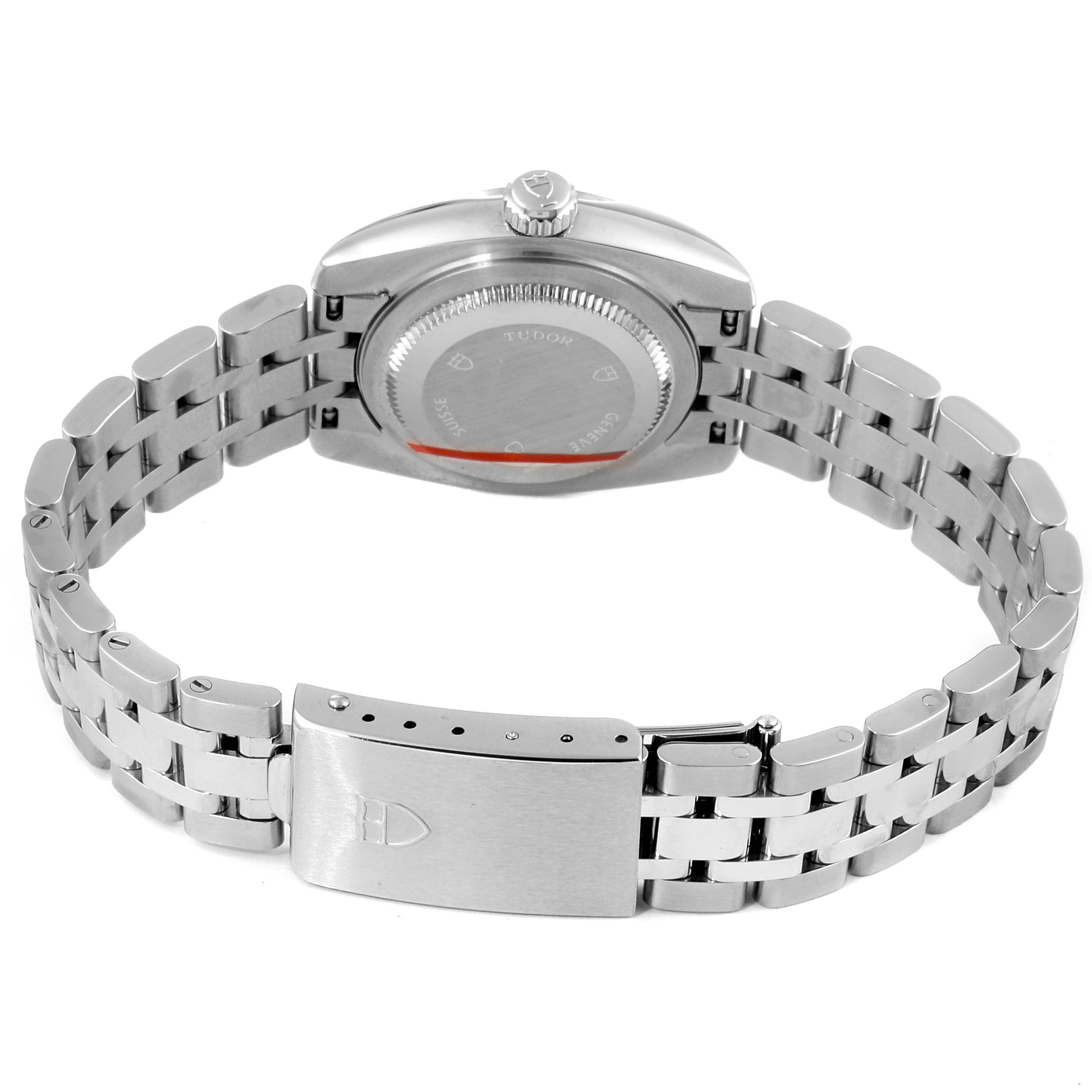 The image shows the back view of the Tudor Classic 22010 Women's Stainless Steel Silver Dial 22010 Women's Stainless Steel Silver Dial model watch, including the case back, crown, and bracelet clasp.