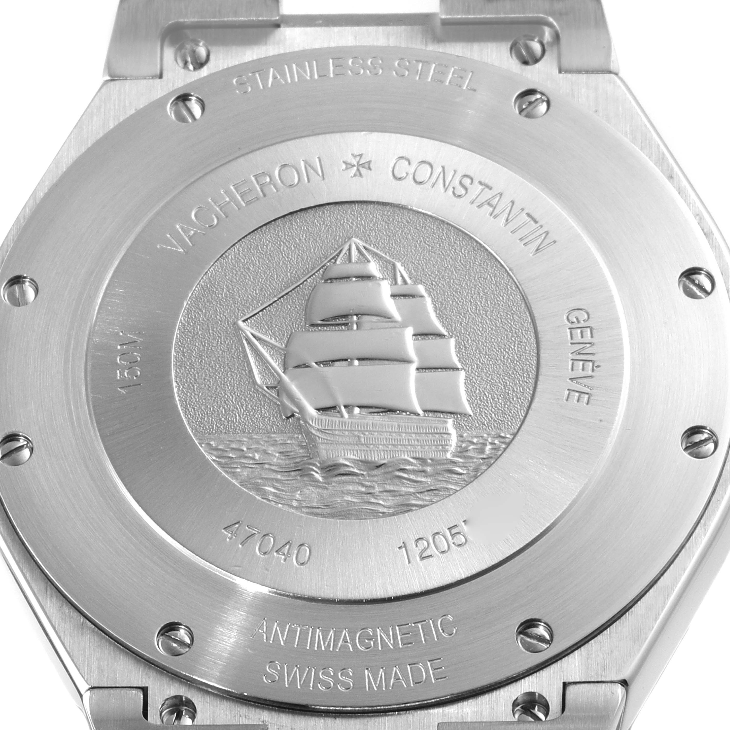 The image shows the case back of the Vacheron Constantin Overseas 47040/000W-9500 Men's Stainless Steel Black Dial 47040/000W-9500 Men's Stainless Steel Black Dial watch, featuring an engraved ship and various inscriptions.