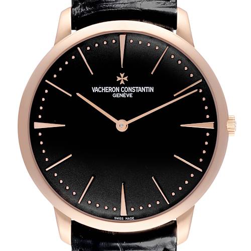 The Vacheron Constantin Patrimony watch is shown from a front angle, showcasing its black dial, gold hands, and minimalist design.