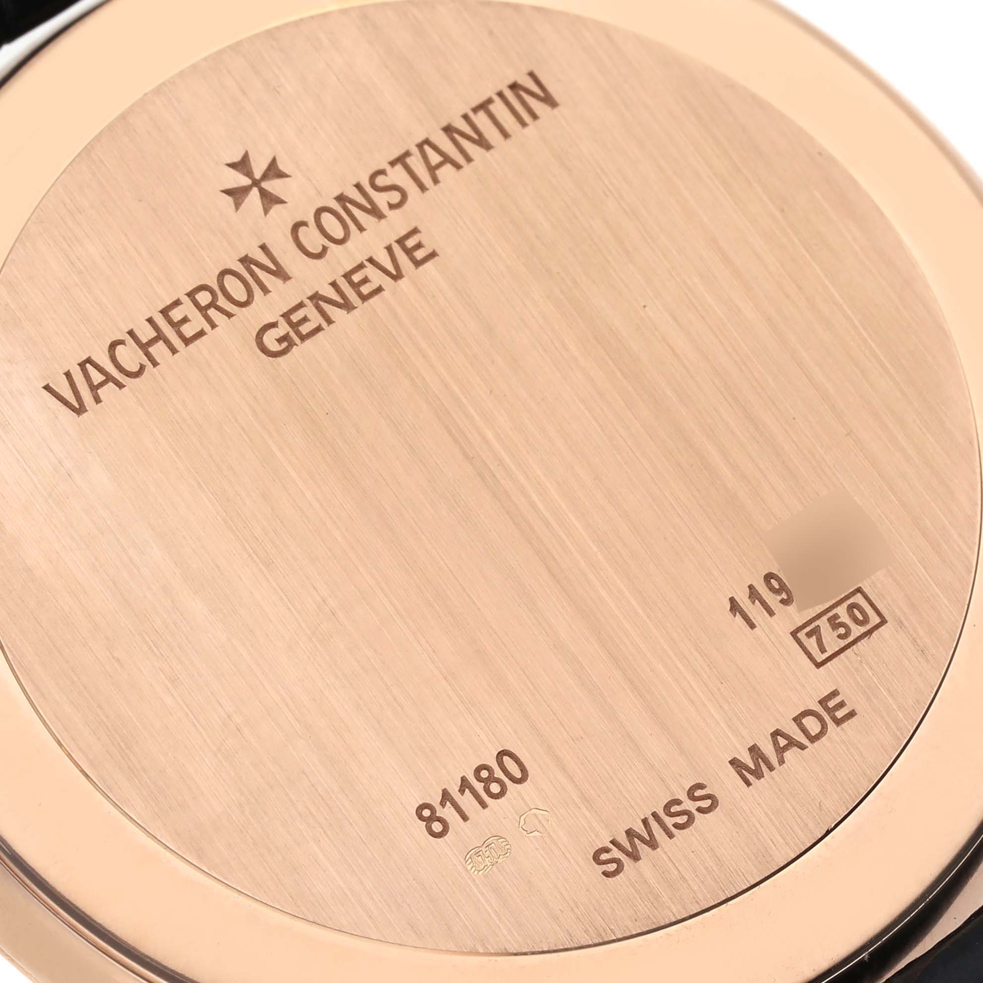 The image shows the back case of the Vacheron Constantin Patrimony 81180/000R-9162 Men's Rose Gold Black Dial 81180/000R-9162 Men's Rose Gold Black Dial watch with engraved details and Swiss Made mark.