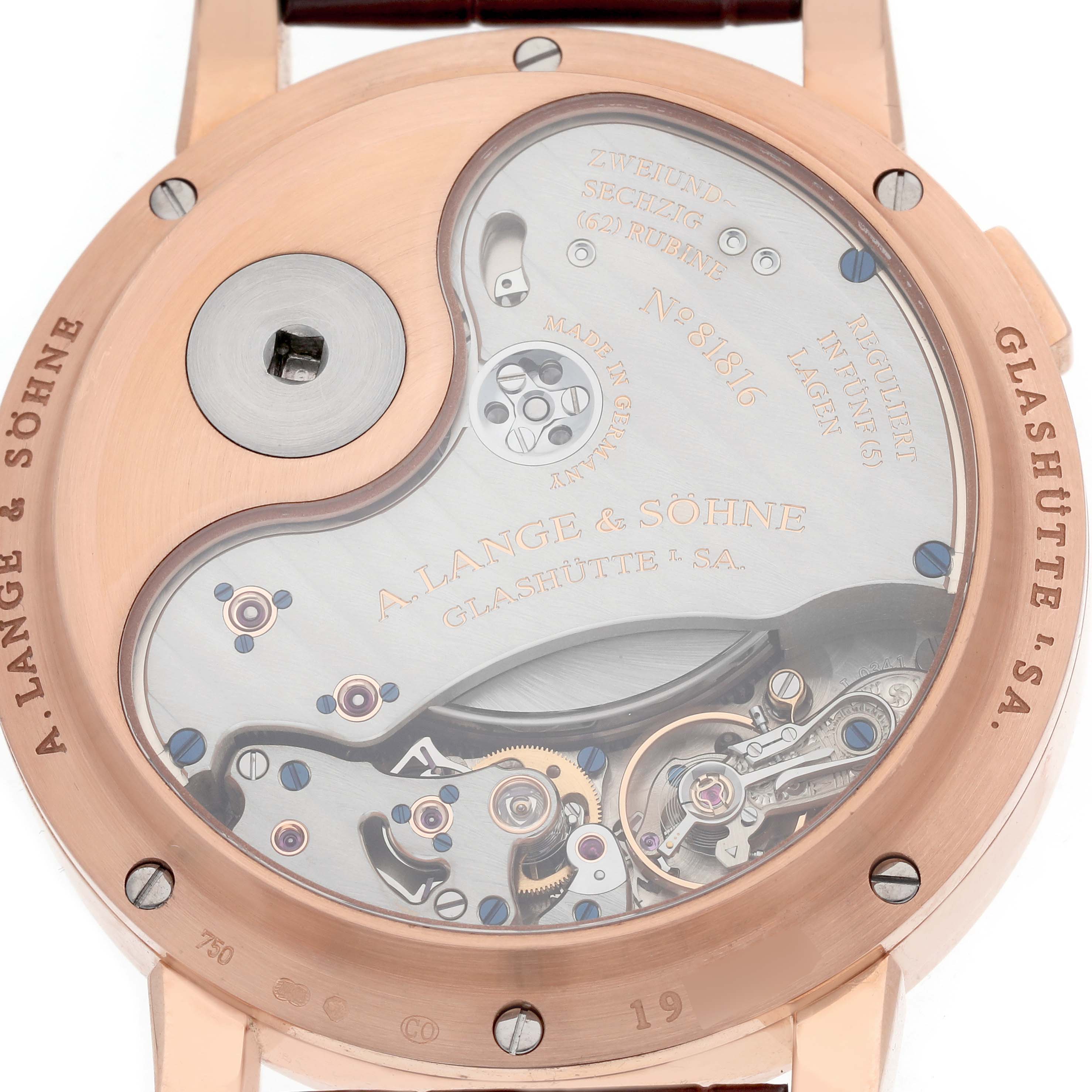 The image shows the back view of the A. Lange 
Sohne Lange 1 130.032F Men
s Rose Gold Silver Dial, highlighting its intricate movement and mechanical parts.
