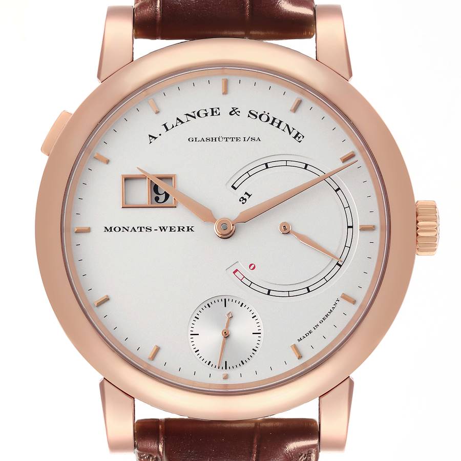 The A. Lange & Söhne Lange 1 watch is shown from the front, highlighting its dial, hands, subdials, and brown strap.