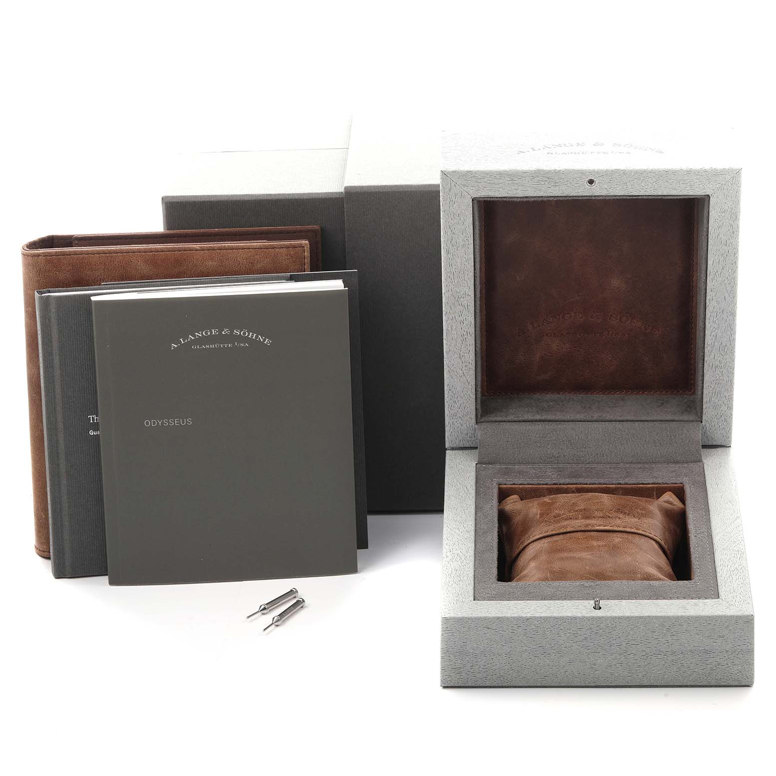 The image shows the A. Lange & Sohne Odysseus 363.068 Men's White Gold Grey Dial watch packaging, manuals, and tools from a frontal angle.