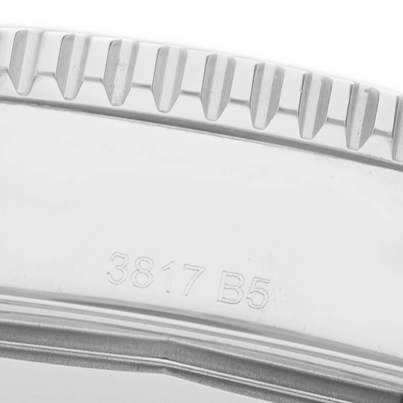 The image shows a close-up of the bezel edge and part of the case back of the Breitling Superocean A17365 Men's Stainless Steel Black Dial watch.