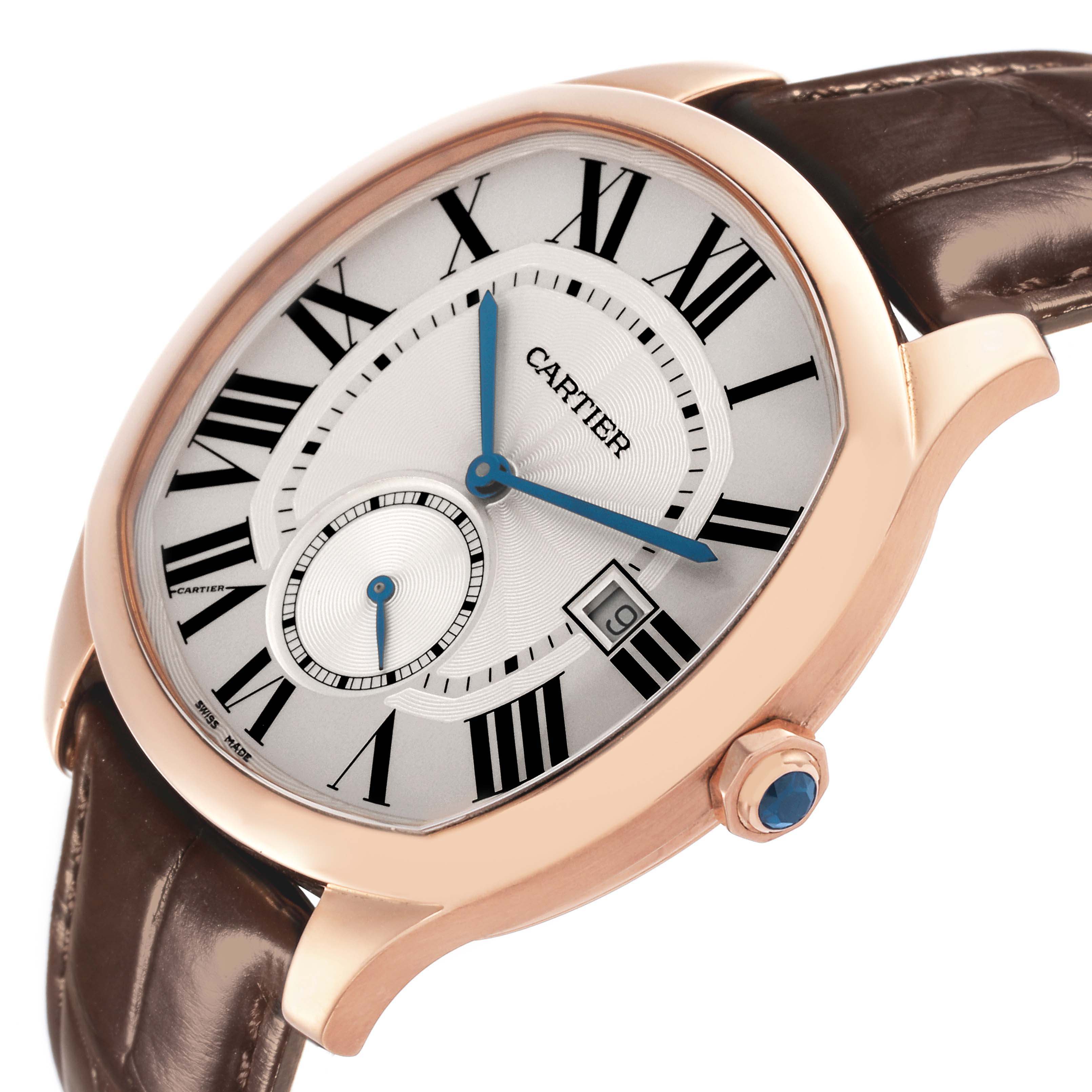The Drive de Cartier watch is shown at an angled view, highlighting the face, Roman numerals, and a blue cabochon crown.