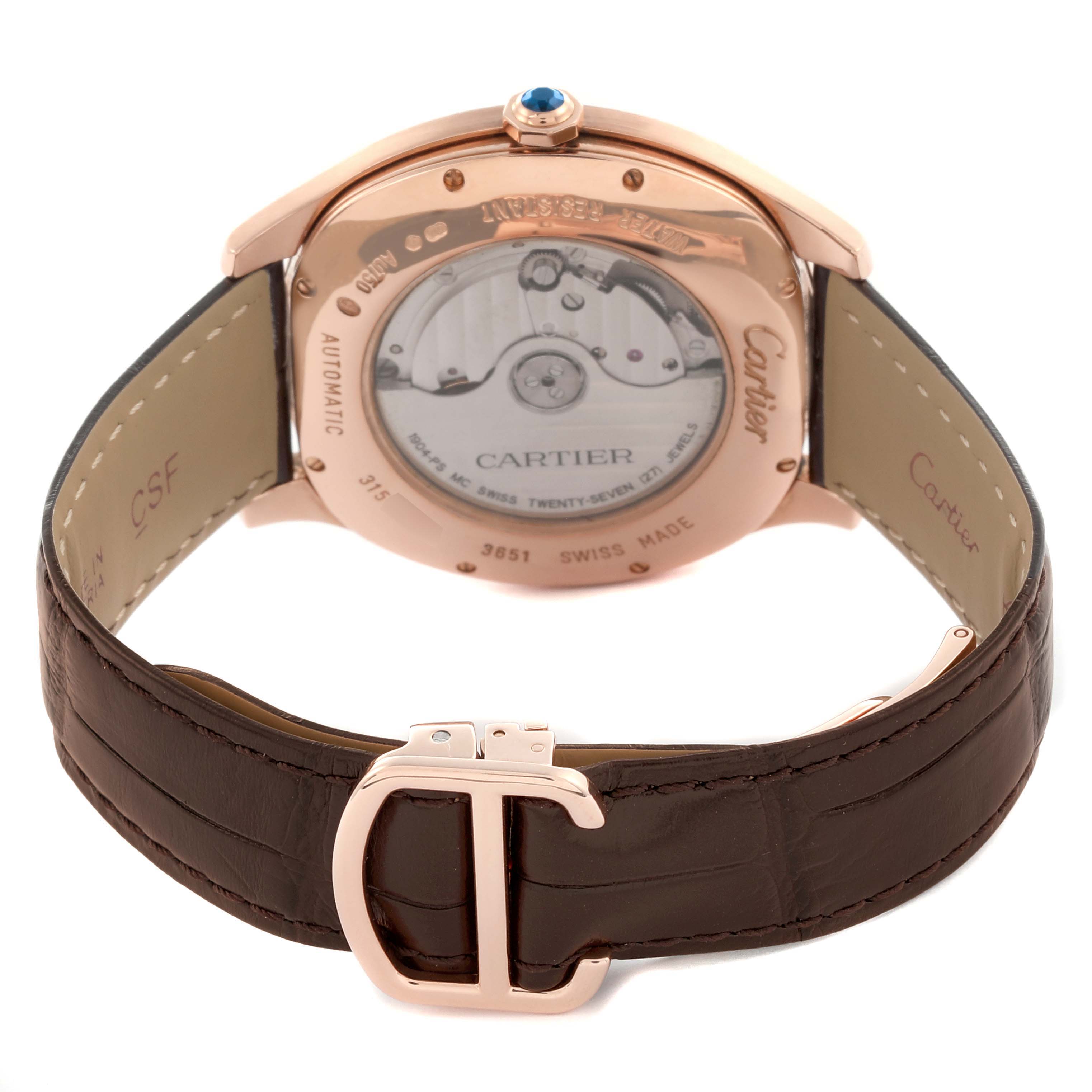 The image shows the back of a Drive de Cartier watch, highlighting its transparent case back and leather strap with a Cartier buckle.