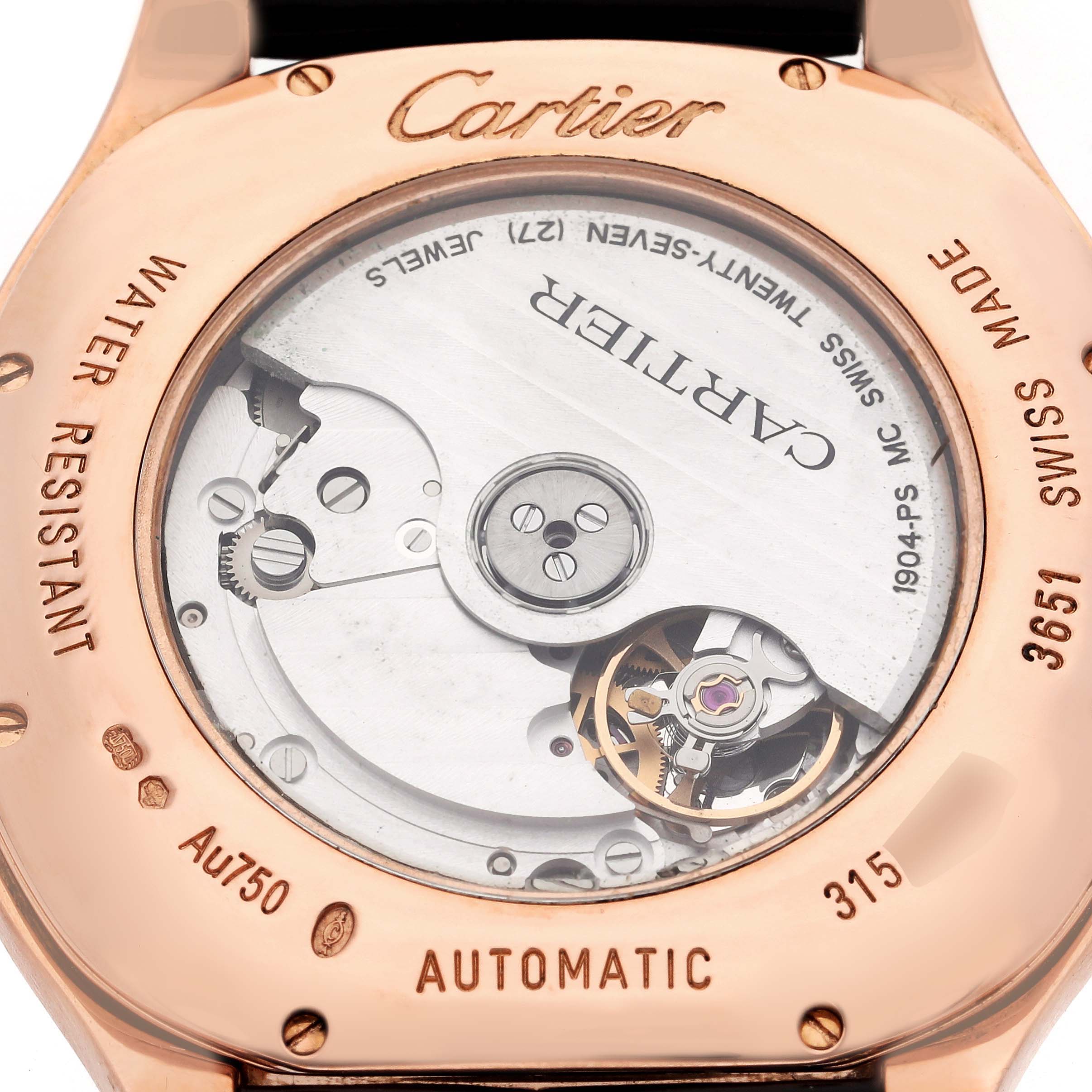 The image shows the back of a Drive de Cartier watch, featuring the movement and engravings.