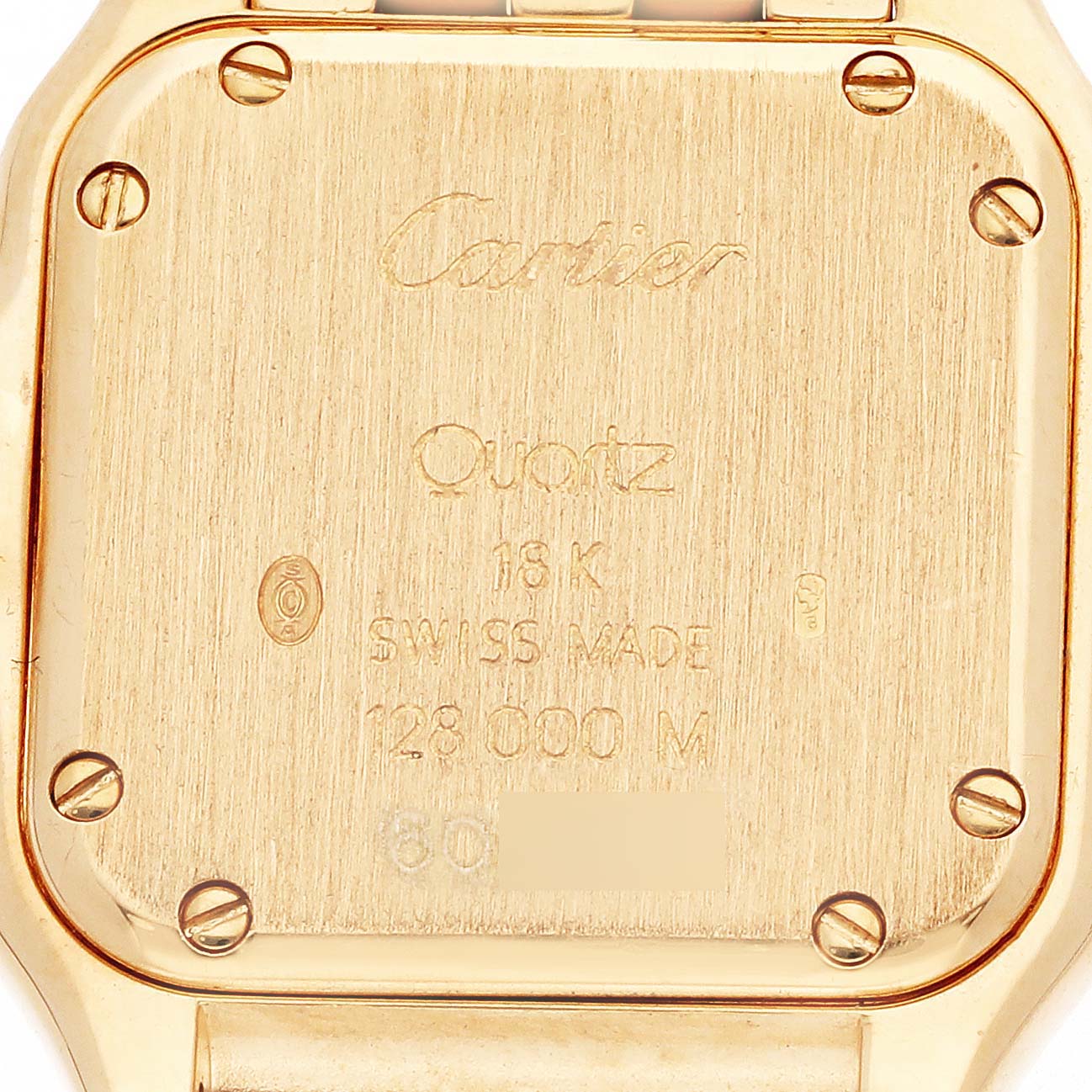 The image shows the back of a Cartier Panthère watch, highlighting the engravings and screws.