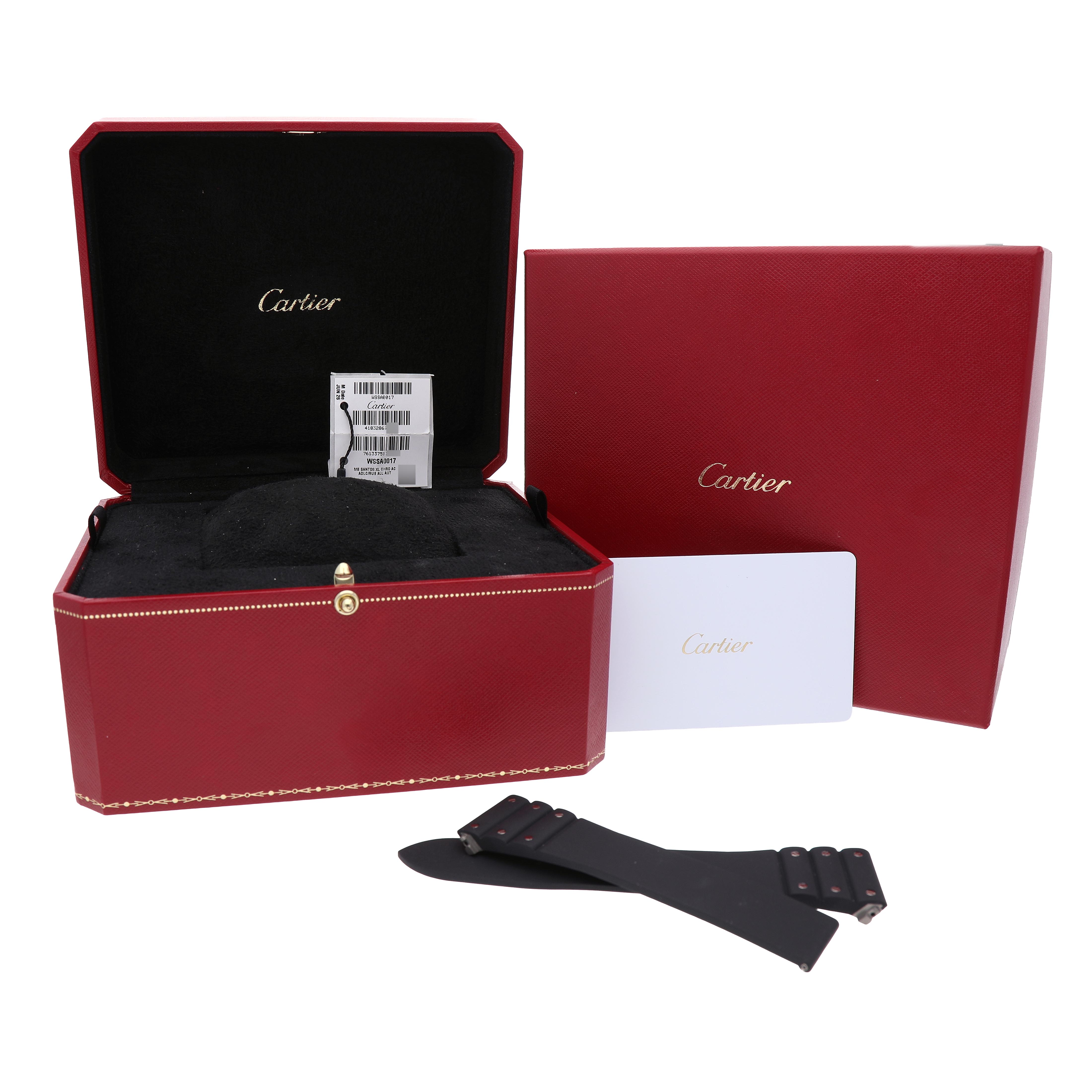 The image shows a Cartier Santos WSSA0017 Men's Stainless Steel Silver Dial watch box, packaging, and additional watch straps, viewed from the front.