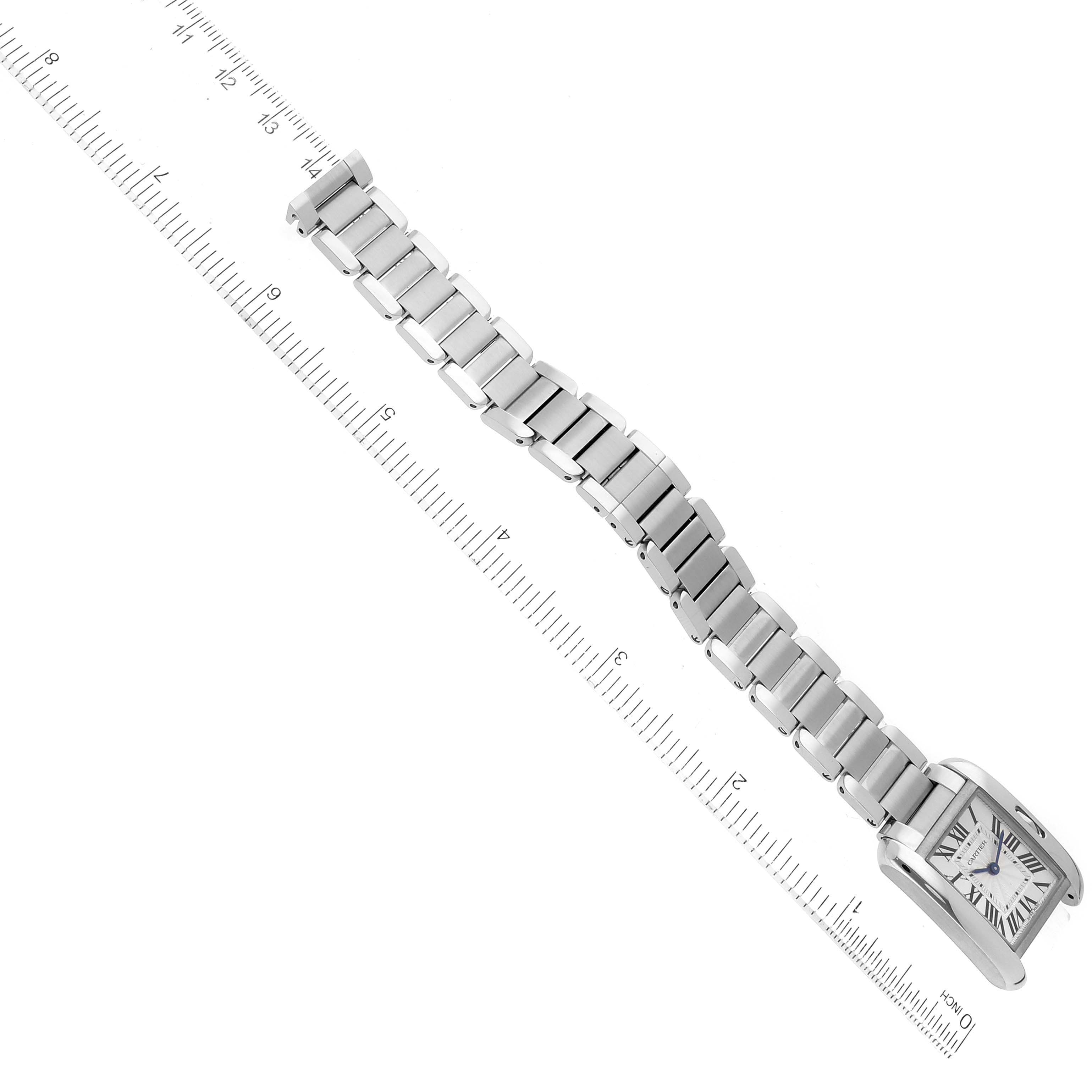 The Cartier Tank Anglaise W5310022 Women
s Stainless Steel Silver Dial W5310022 Women
s Stainless Steel Silver Dial watch is shown from an overhead angle, displaying the entire watch including its face, casing, and metal bracelet.