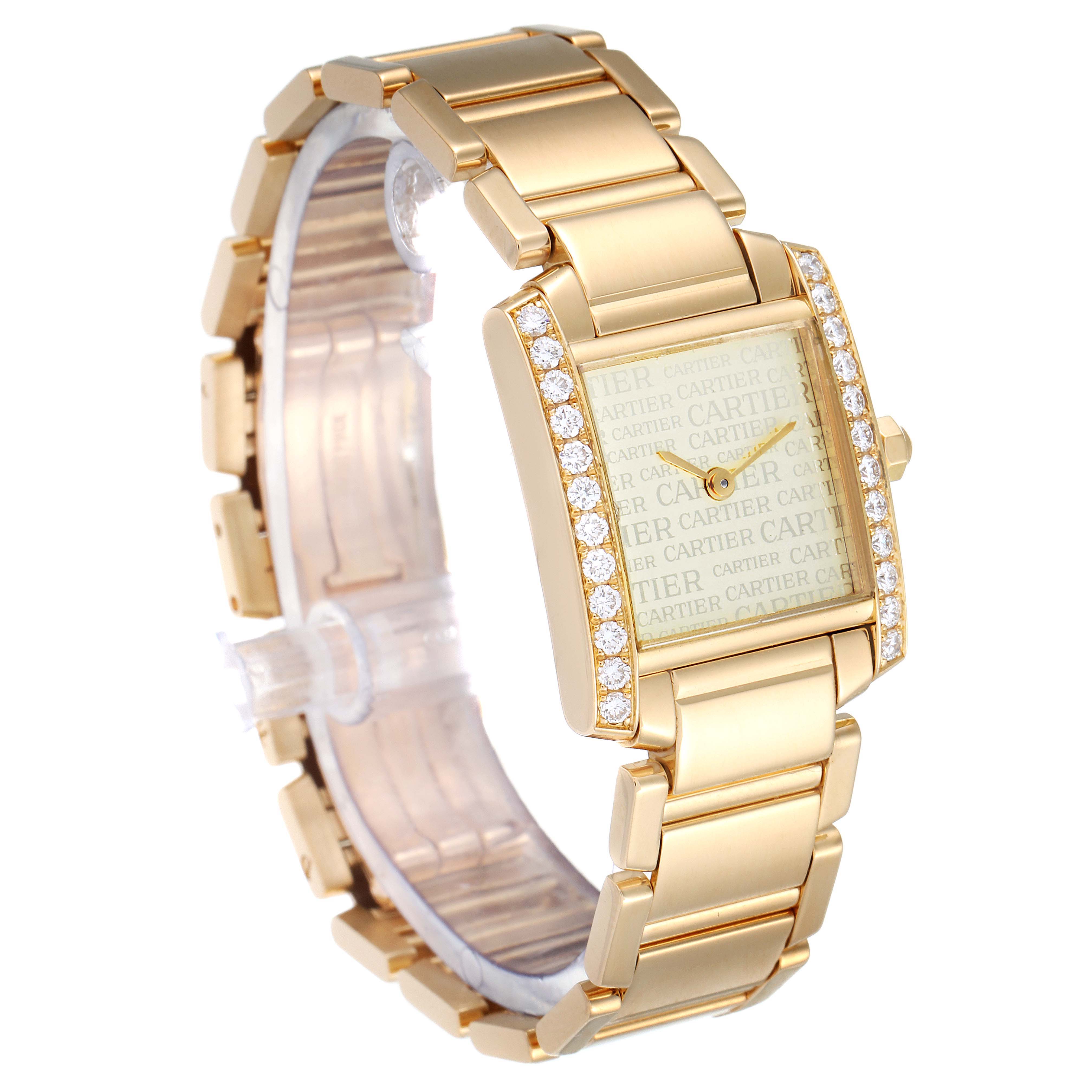 The image shows a gold Cartier Tank Francaise WE1023R8 Women
s Yellow Gold Silver Dial WE1023R8 Women
s Yellow Gold Silver Dial watch at a slight angle, highlighting its diamond-studded bezel and metal bracelet.