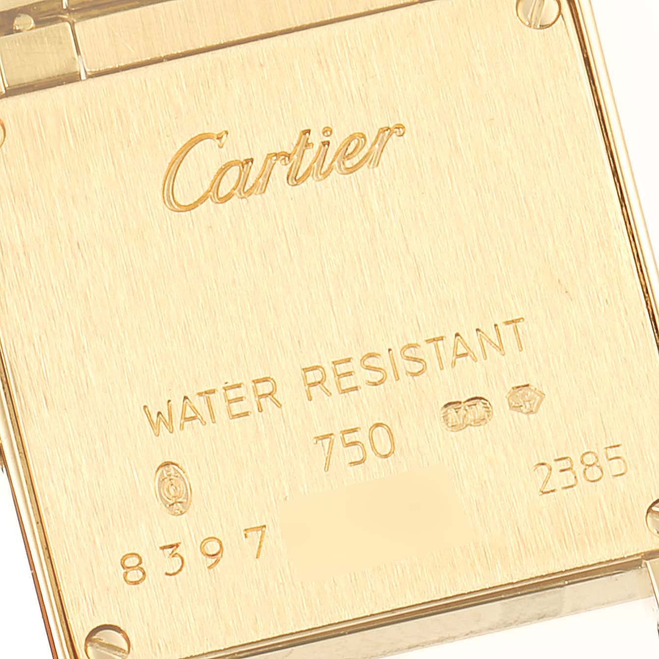 The image shows the back casing of a Cartier Tank Française watch, highlighting brand engraving and water-resistant markings.