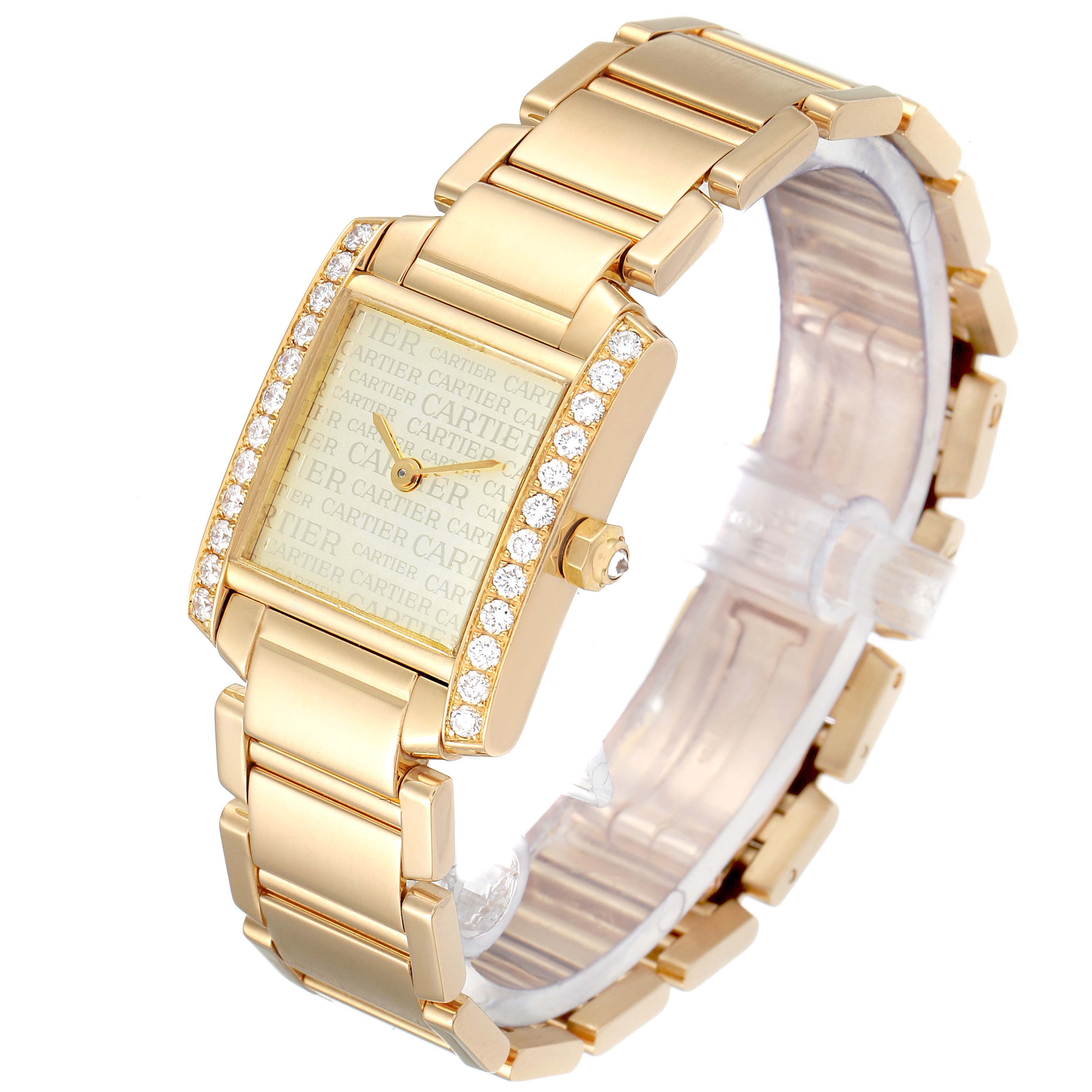 This Cartier Tank Francaise WE1023R8 Women
s Yellow Gold Silver Dial WE1023R8 Women
s Yellow Gold Silver Dial watch is shown at an angled view displaying the face, bezel, crown, and bracelet.