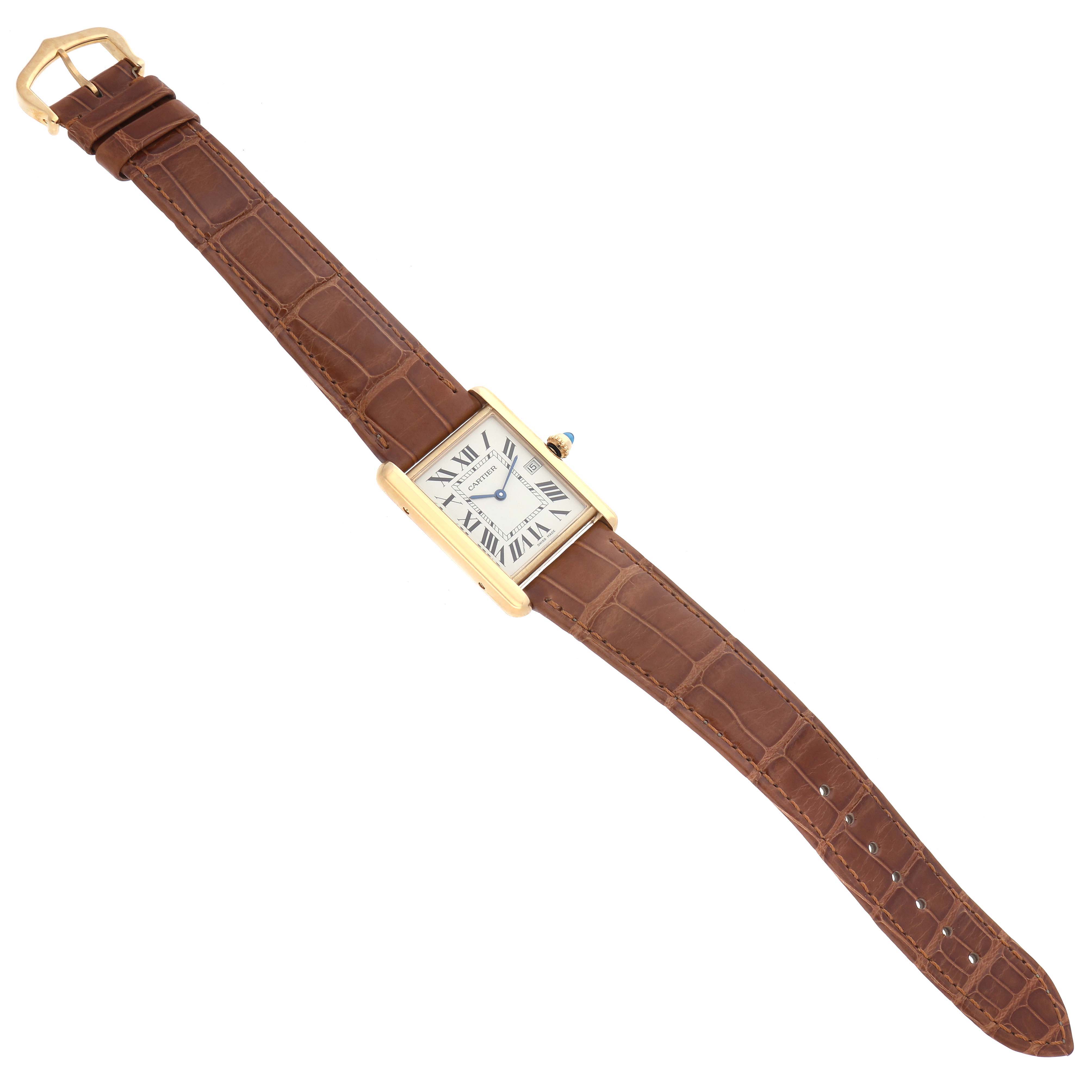 The Cartier Tank Louis W1529756 Men's Yellow Gold Silver Dial W1529756 Men's Yellow Gold Silver Dial watch is shown from an angled view, highlighting the face, gold case, and brown leather strap.