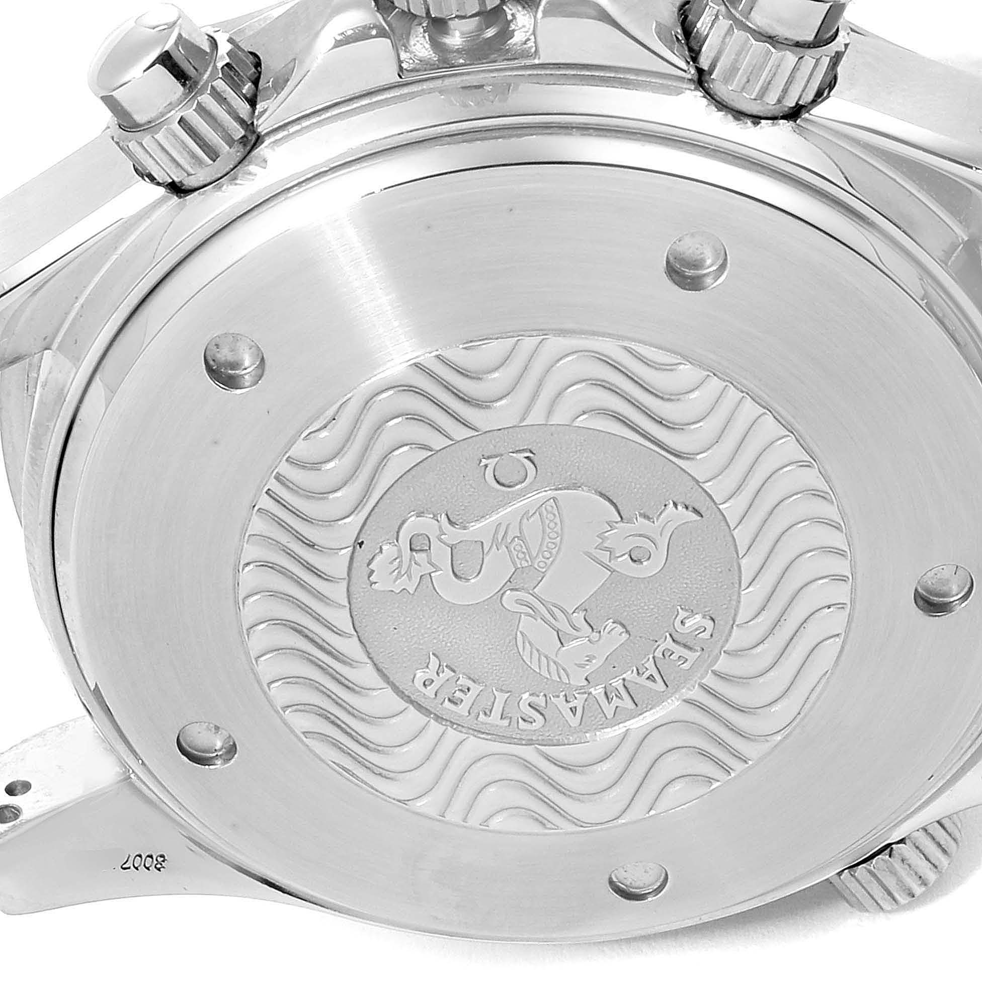 This image shows the back case and crowns of the Omega Seamaster 2599.80.00 Men
s Stainless Steel Blue Dial 2599.80.00 Men
s Stainless Steel Blue Dial watch, highlighting the embossed design and wave pattern.