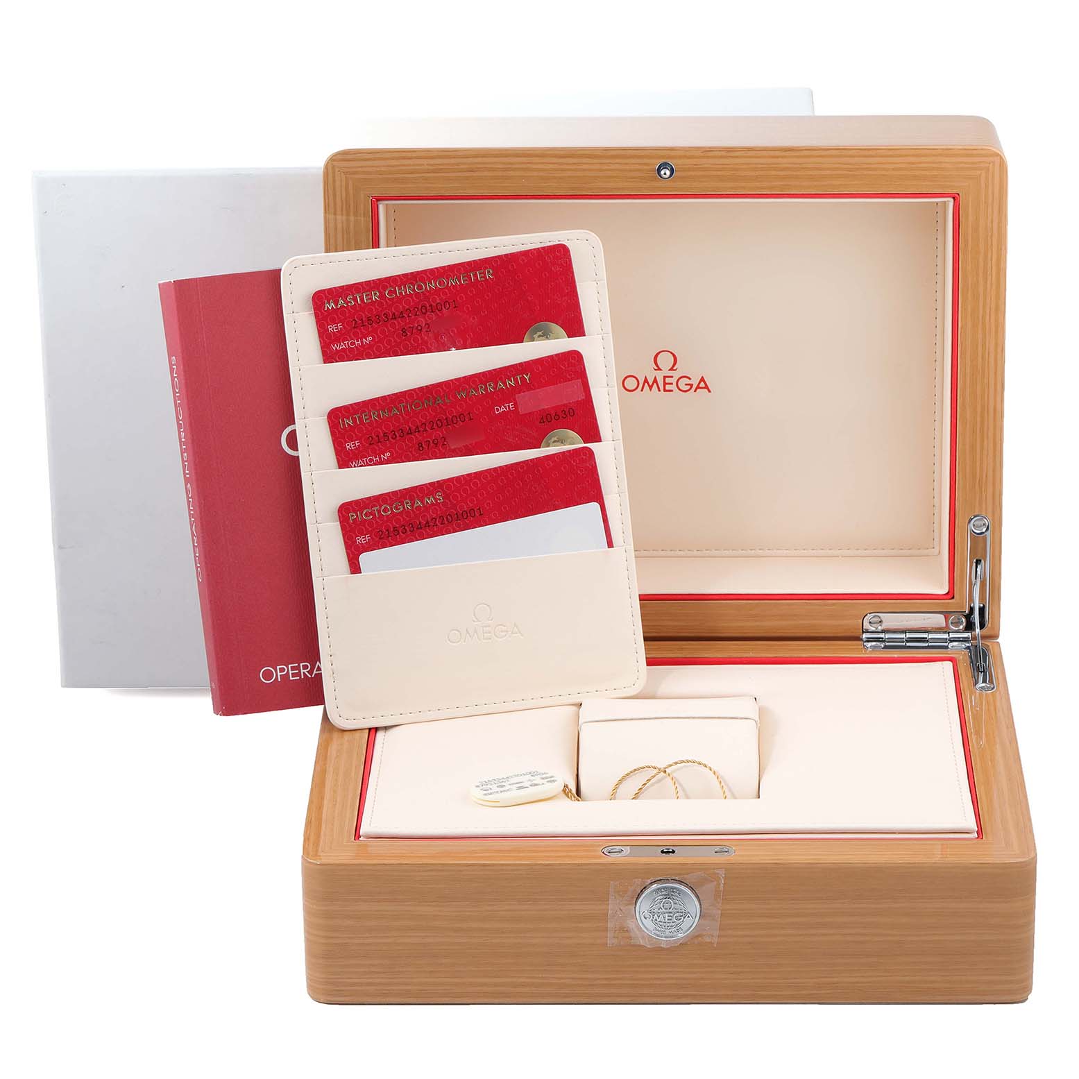 The image shows an open wooden box for the Omega Planet Ocean 215.33.44.22.03.001 Men's Stainless Steel Black Dial 215.33.44.22.03.001 Men's Stainless Steel Black Dial with accompanying warranty cards and booklets.