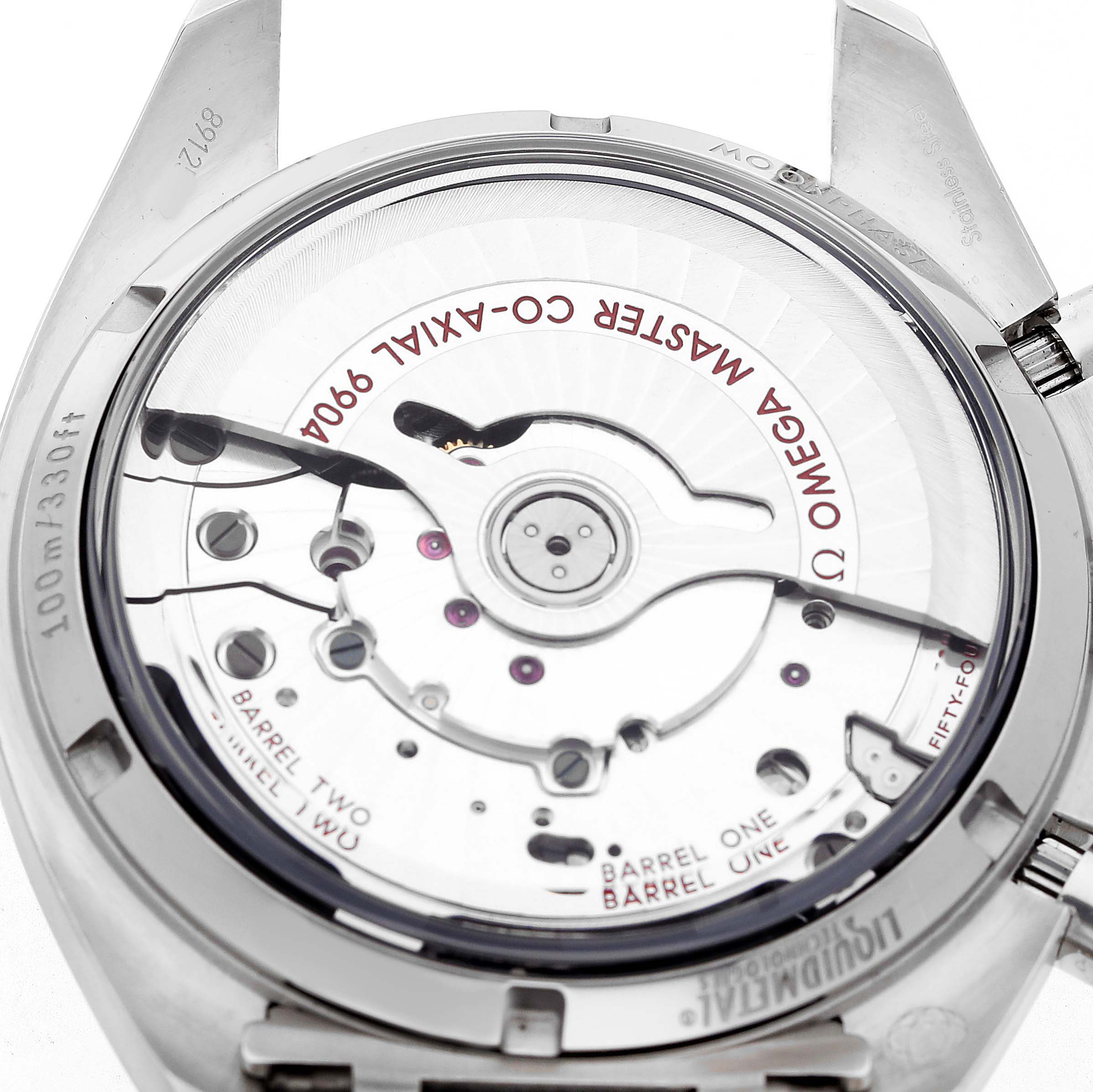 The image shows the back of an Omega Speedmaster 304.30.44.52.01.001 Men's Stainless Steel Black Dial, highlighting its movement and co-axial escapement.