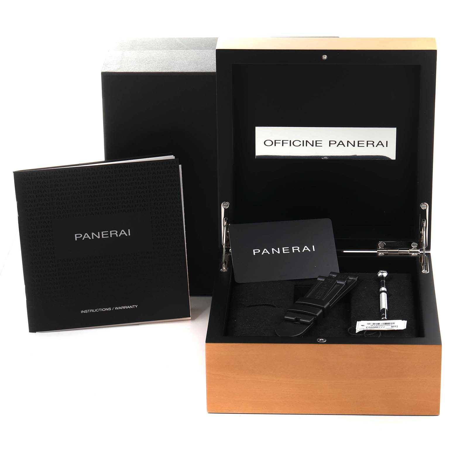 The image shows an open box with Panerai Luminor PAM00777 Men
s Stainless Steel Black Dial PAM00777 Men
s Stainless Steel Black Dial accessories, including a manual, extra strap, and toolset.