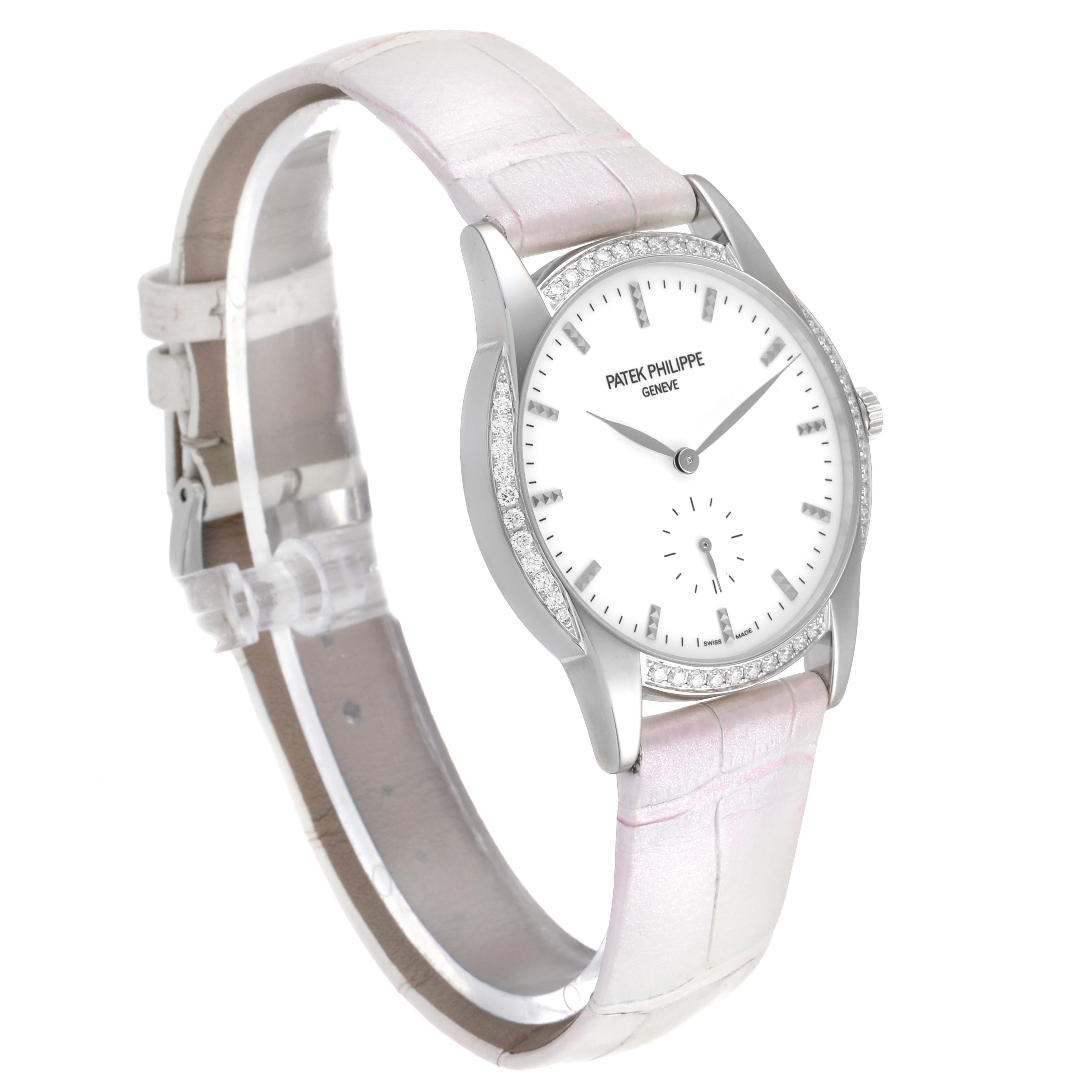 This Patek Philippe Calatrava 7122/200G Women's White Gold White Dial 7122/200G Women's White Gold White Dial model is shown at a slight angle, displaying its dial, bezel, and leather strap.