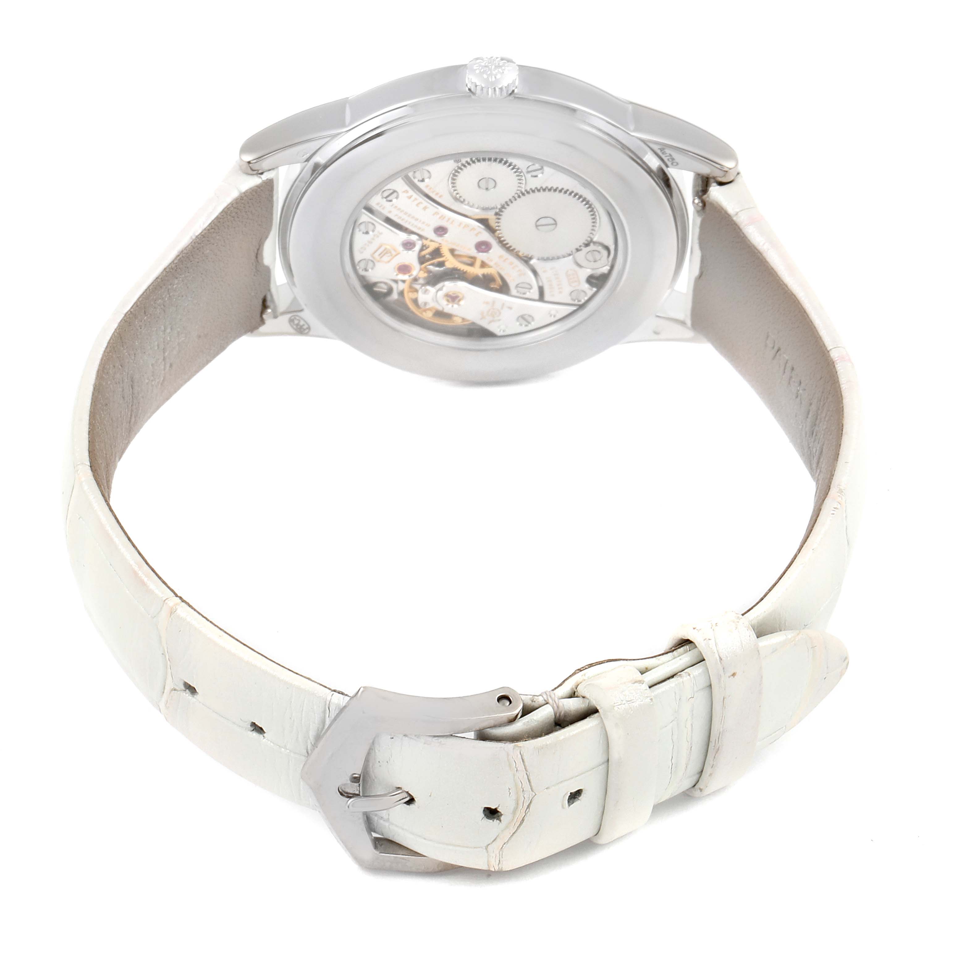The image shows the back view of a Patek Philippe Calatrava 7122/200G Women's White Gold White Dial 7122/200G Women's White Gold White Dial watch, highlighting the inner mechanics and white leather strap.